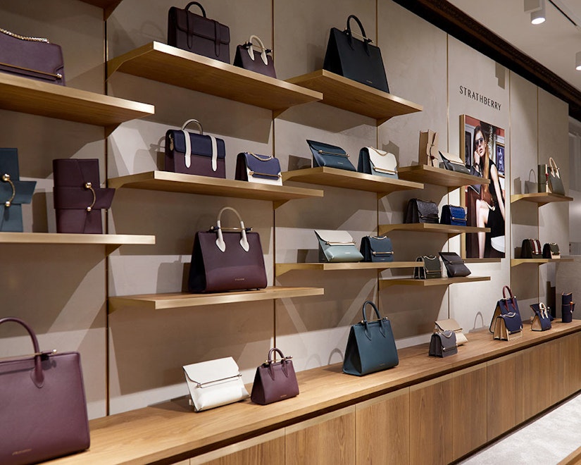 A display of handbags and purses in a store