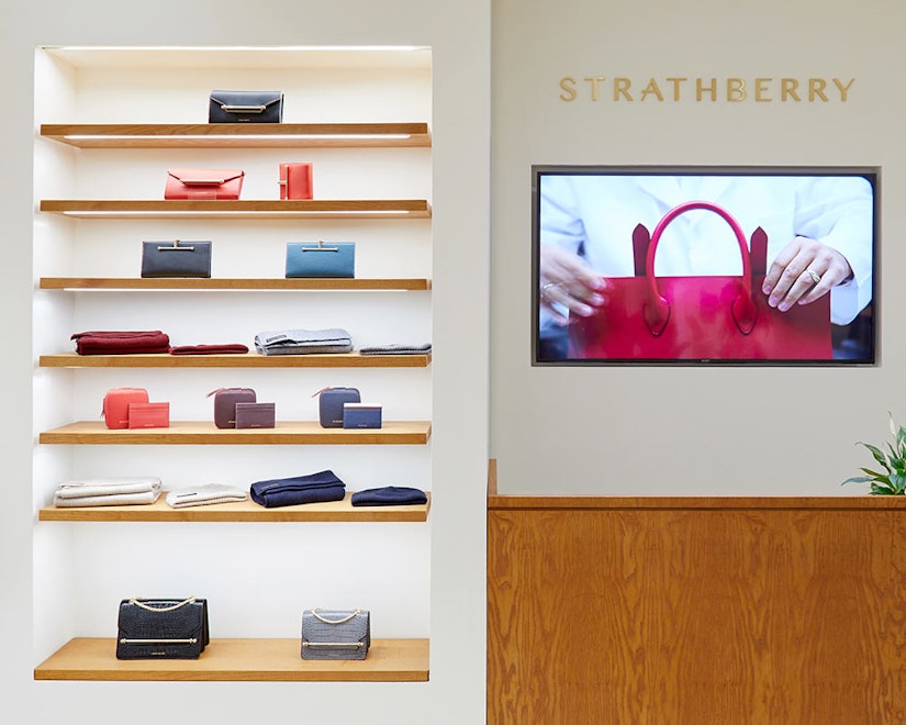 A display of handbags and purses in a store