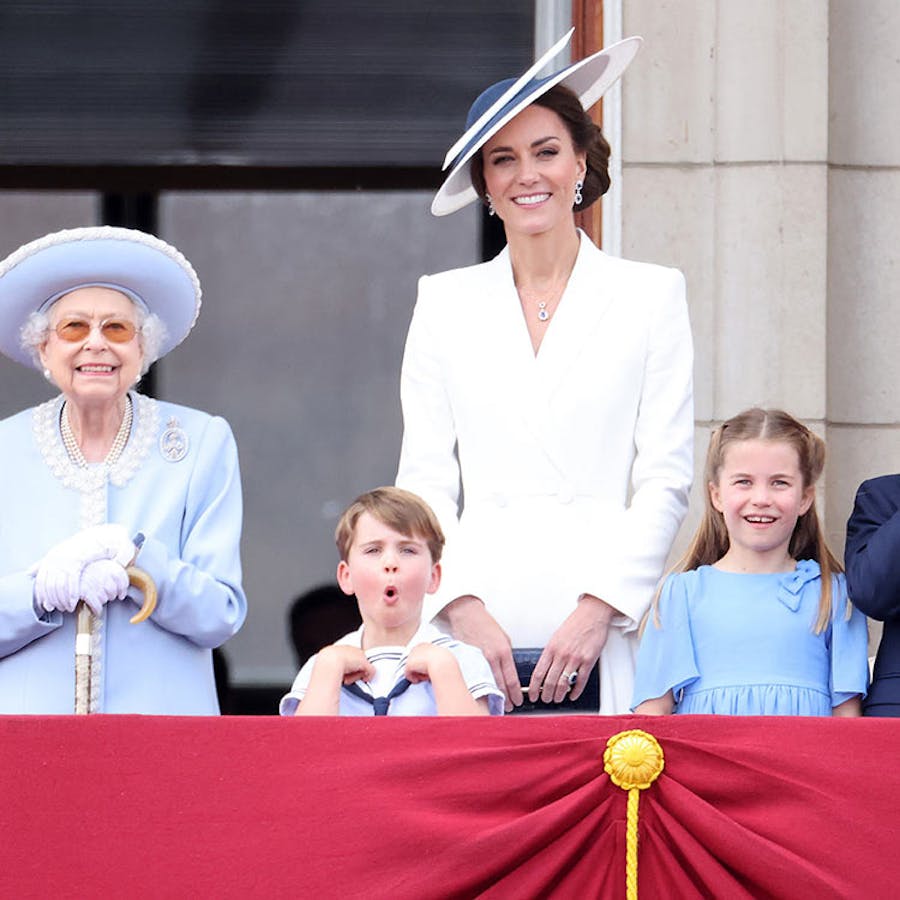 A group of people standing next to each other on a balcony