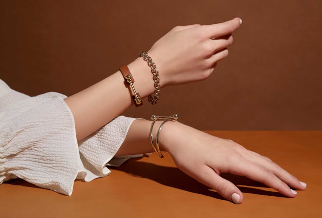 A woman's hand with a bracelet on it