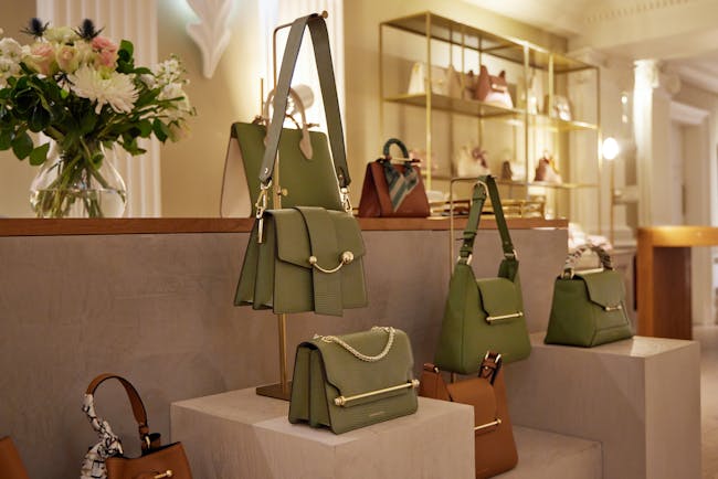 A display of purses and handbags in a store