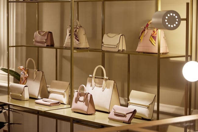 A display of purses and handbags in a store