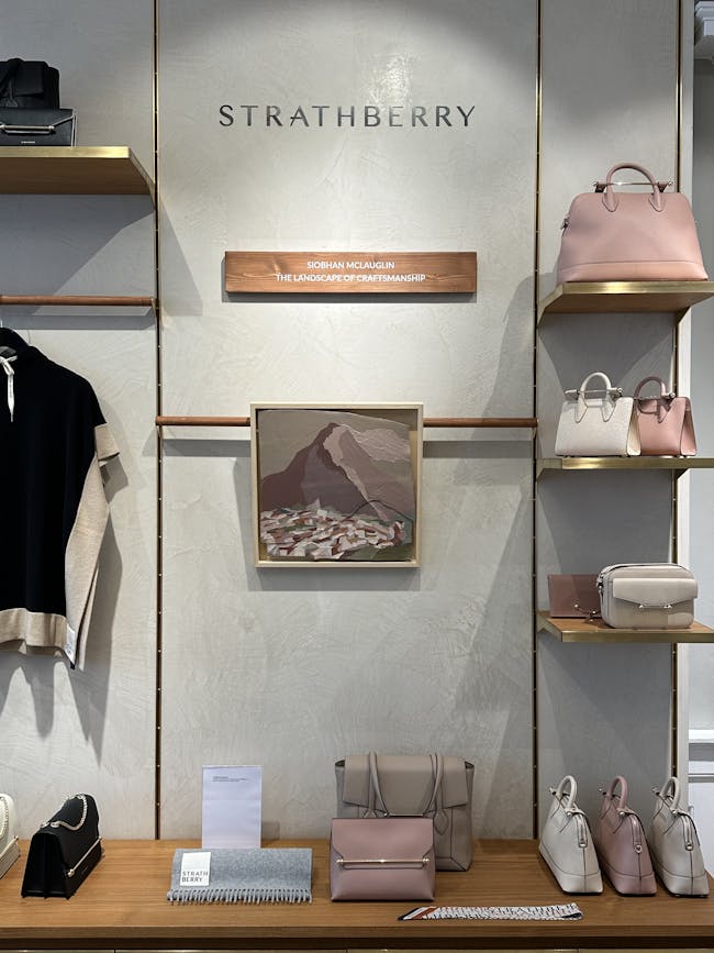A display of handbags and purses in a store