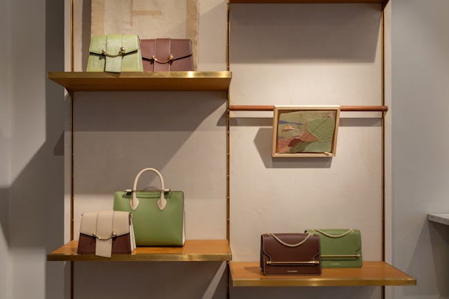 A display of purses and handbags in a store