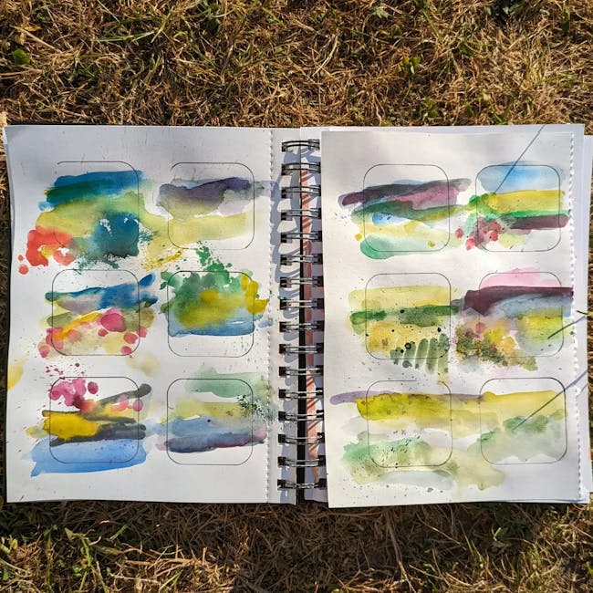 A book with a bunch of watercolors on it