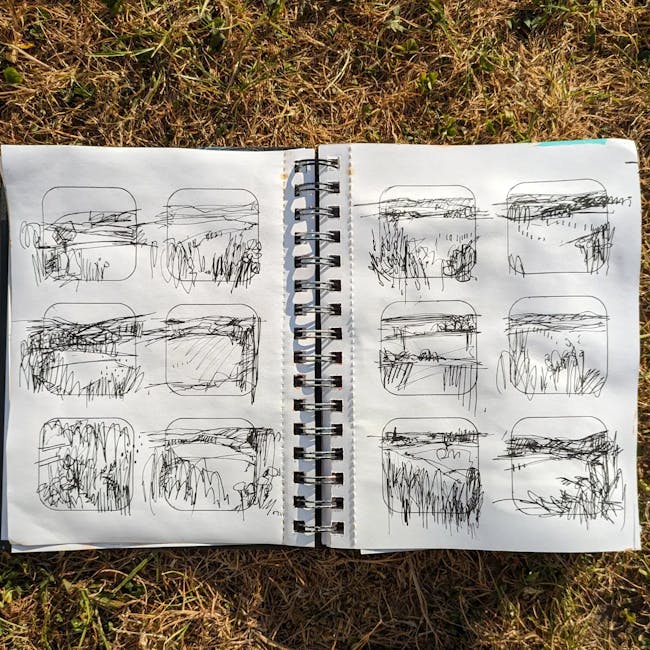 A notebook with a drawing of a landscape