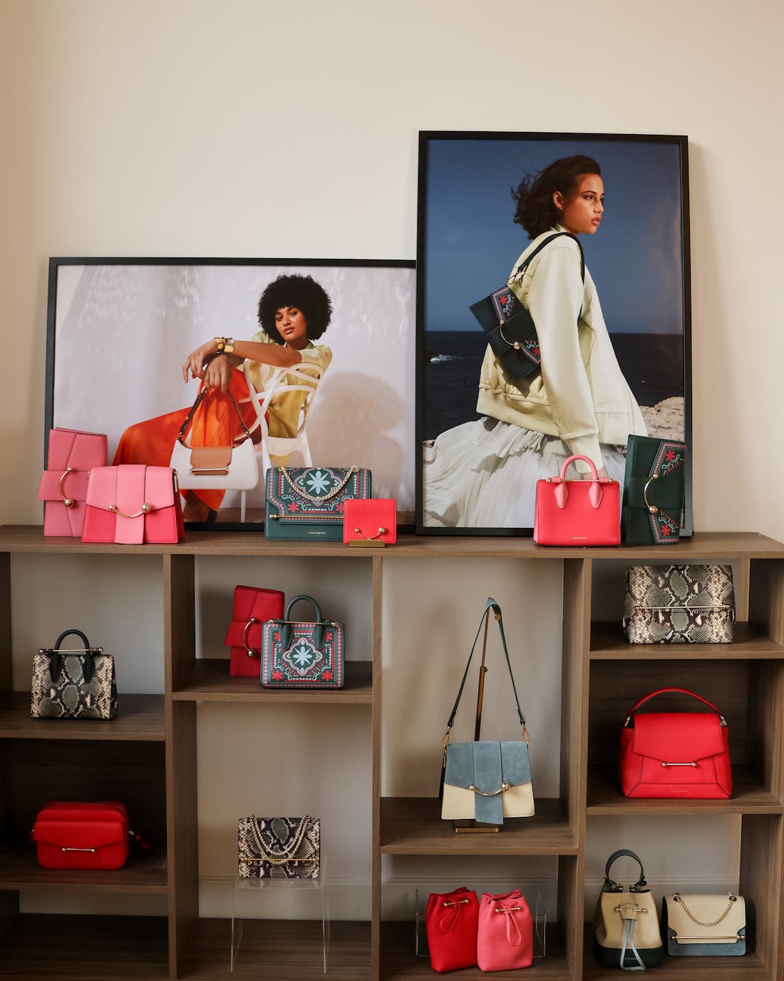 A display of handbags and purses on a shelf