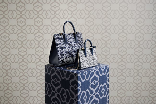 A couple of bags sitting on top of a box