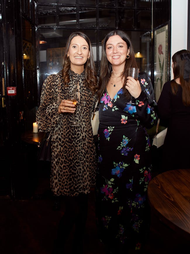 A couple of women standing next to each other