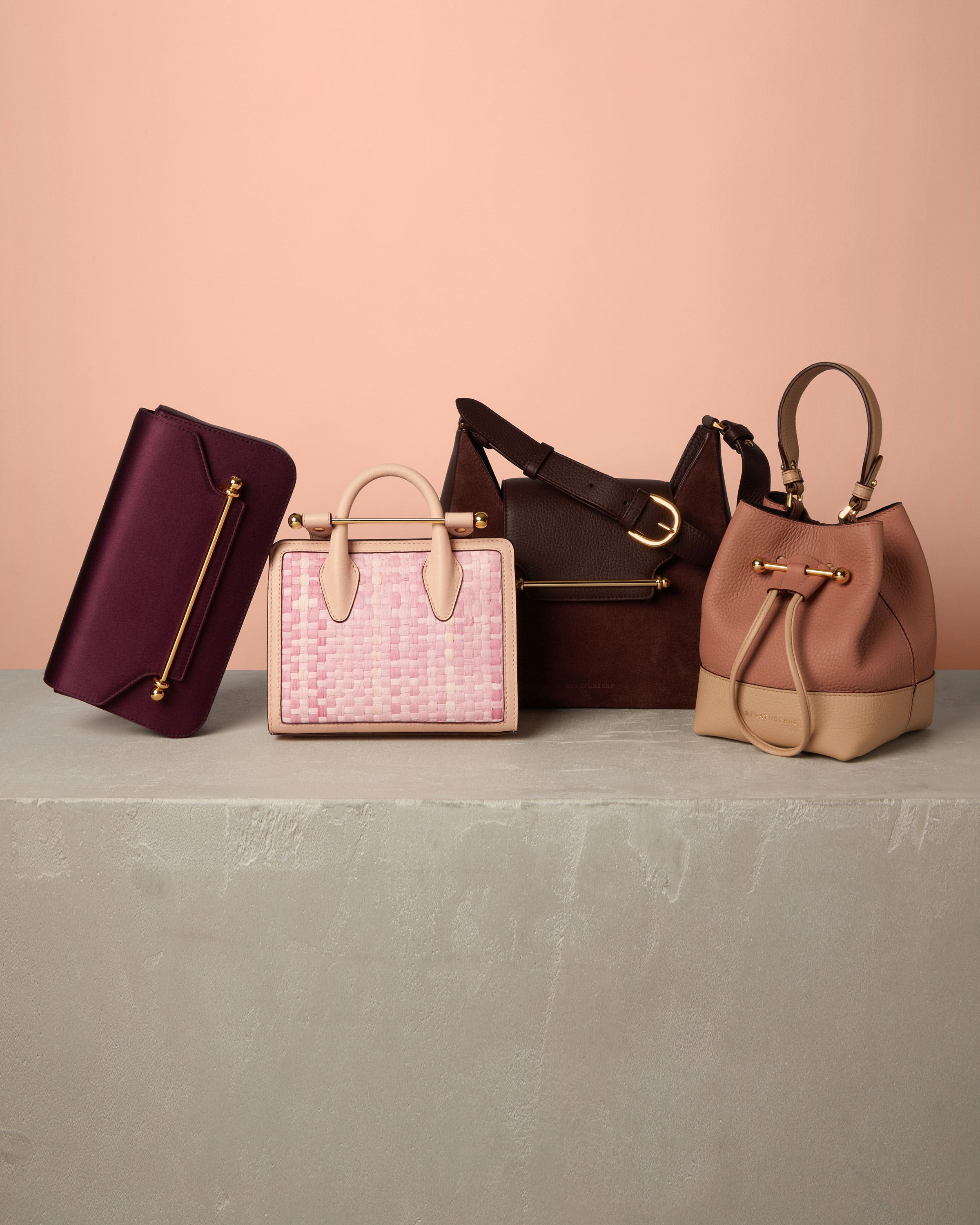 A group of three purses sitting on top of a table