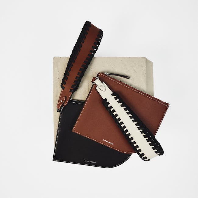 A couple of purses sitting on top of a table