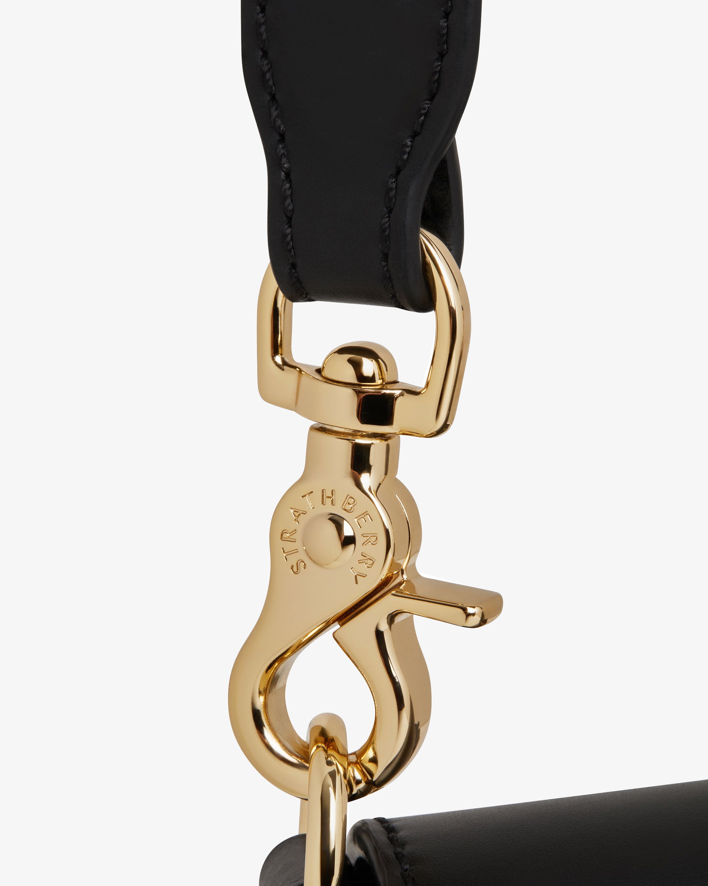 A black and gold keychain with a metal hook