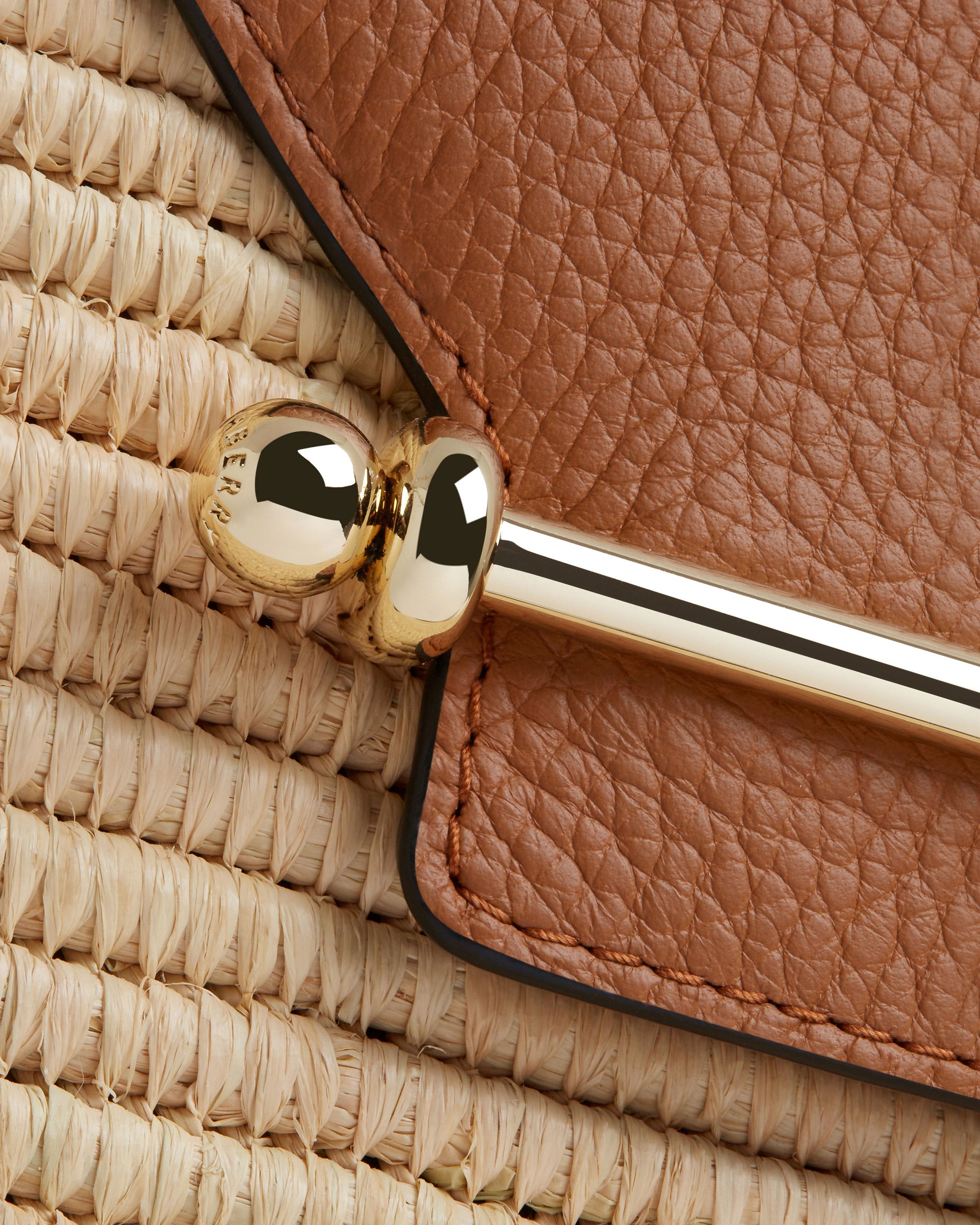 A close up of a handle on a purse