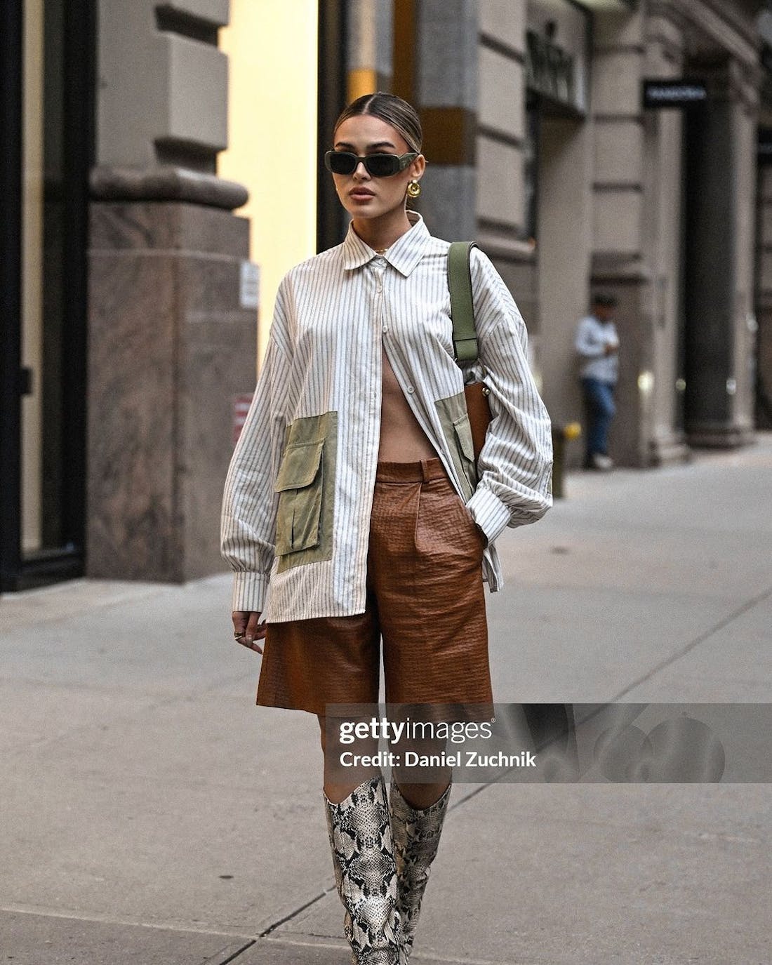 A woman is seen walking down the street in new york city