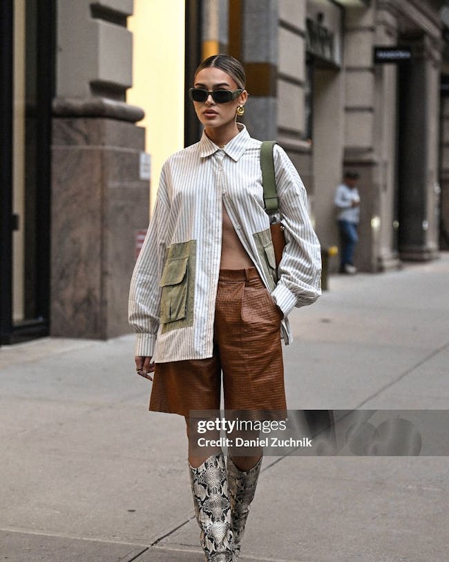 A woman is seen walking down the street in new york city