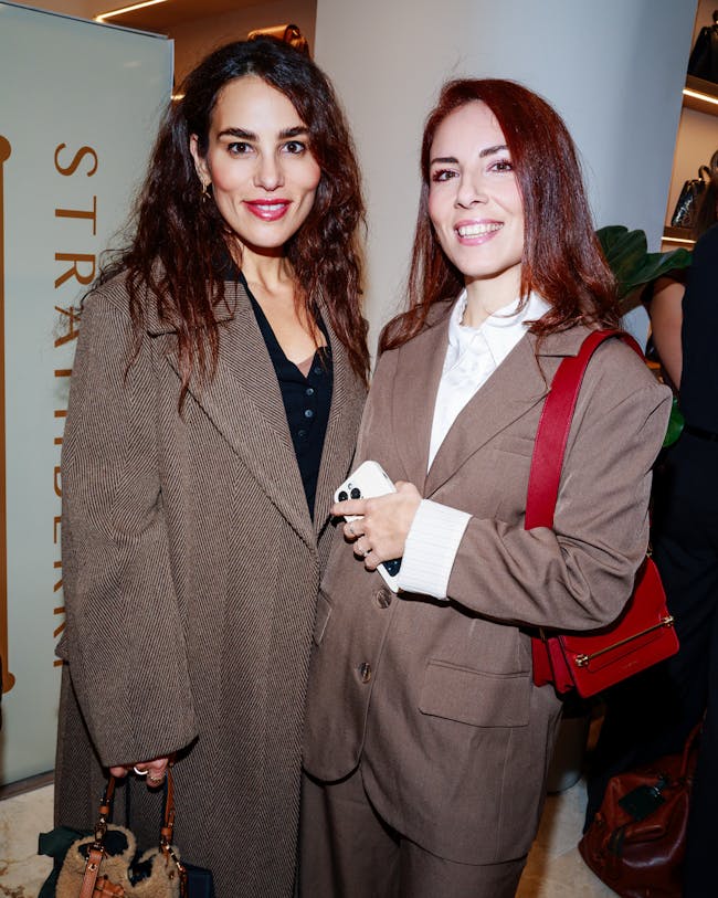 A couple of women standing next to each other