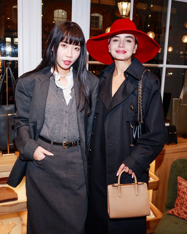A couple of women standing next to each other