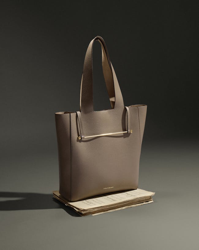 A white purse sitting on top of a table