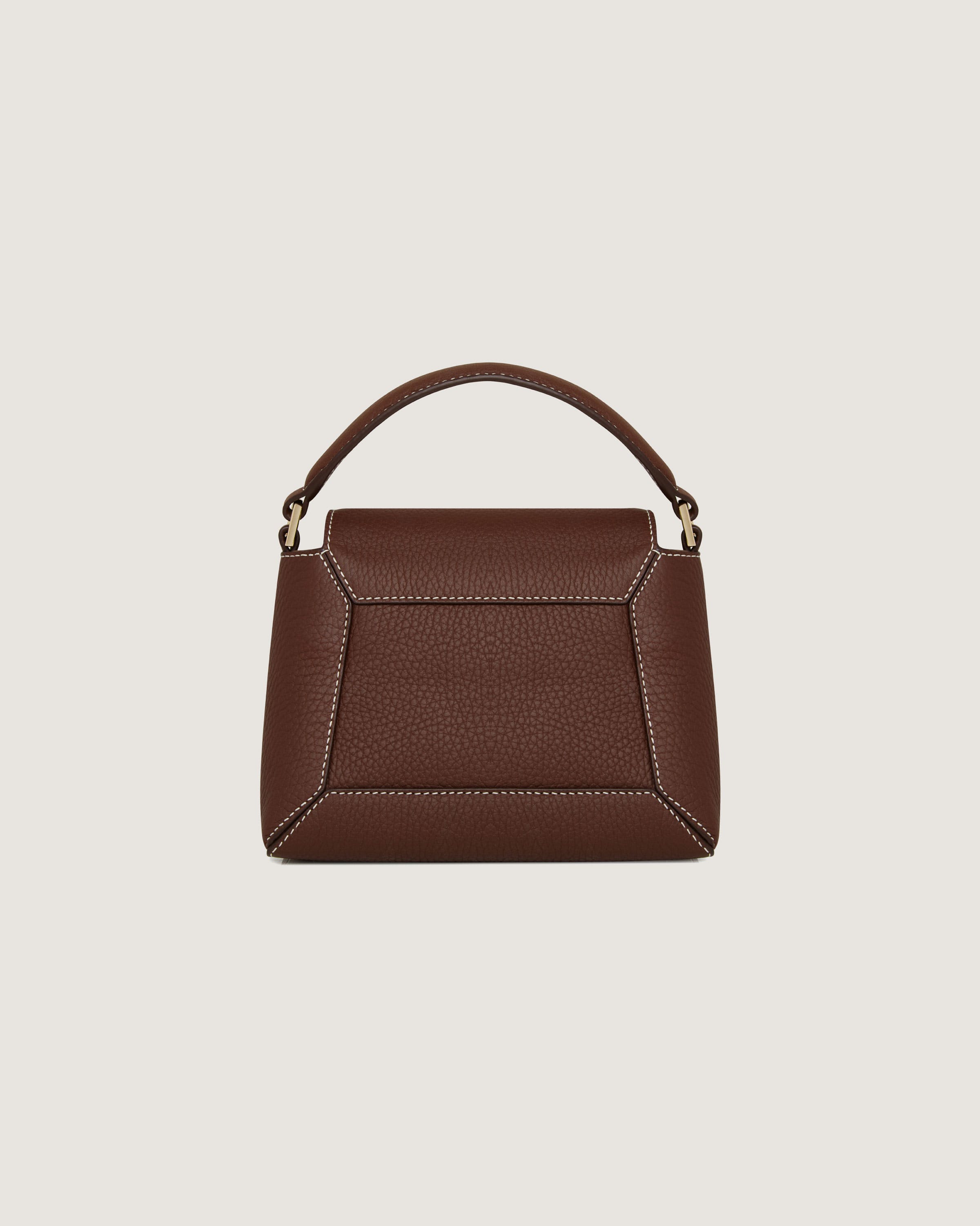 A brown handbag on a white background