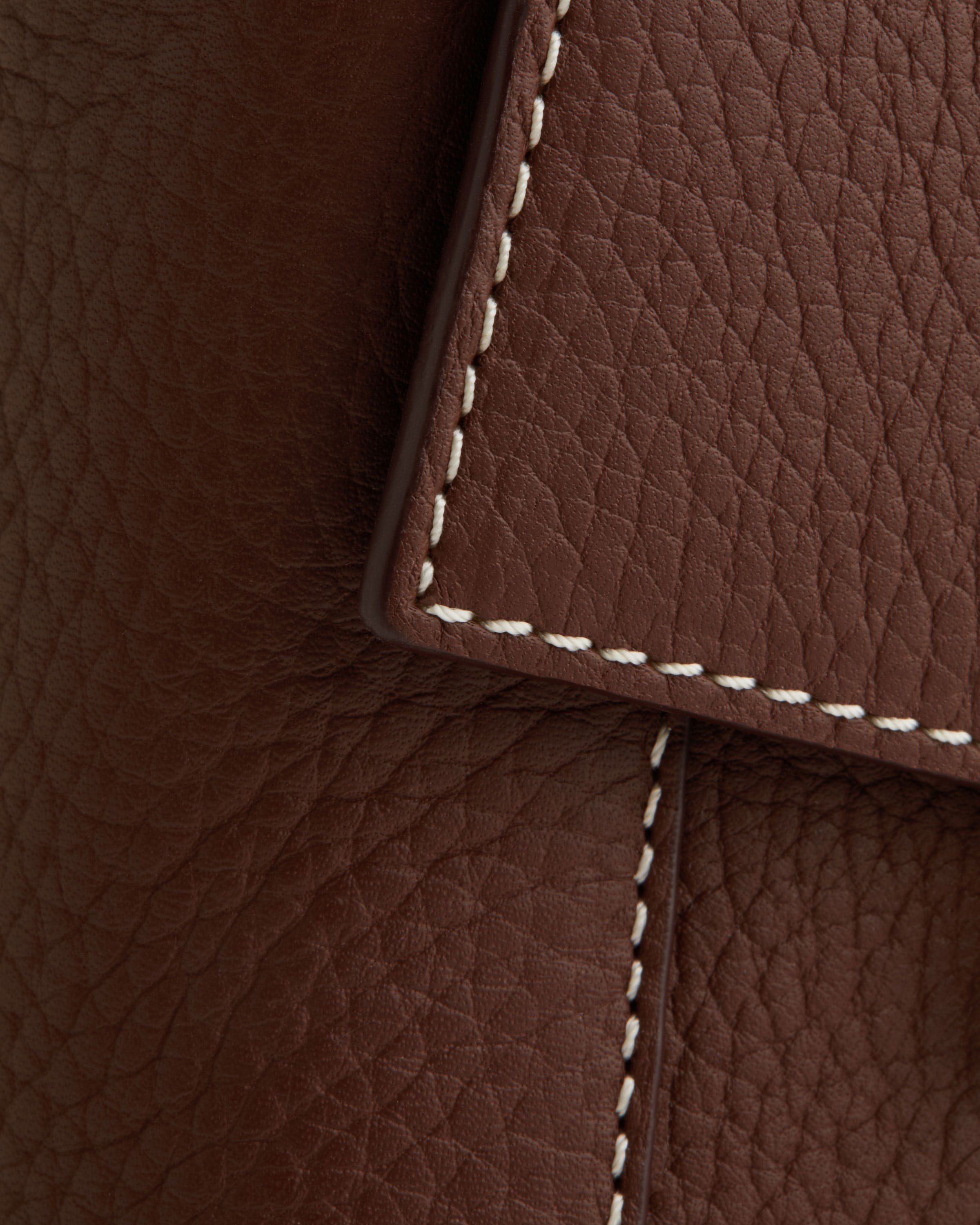 A close up of a brown leather material