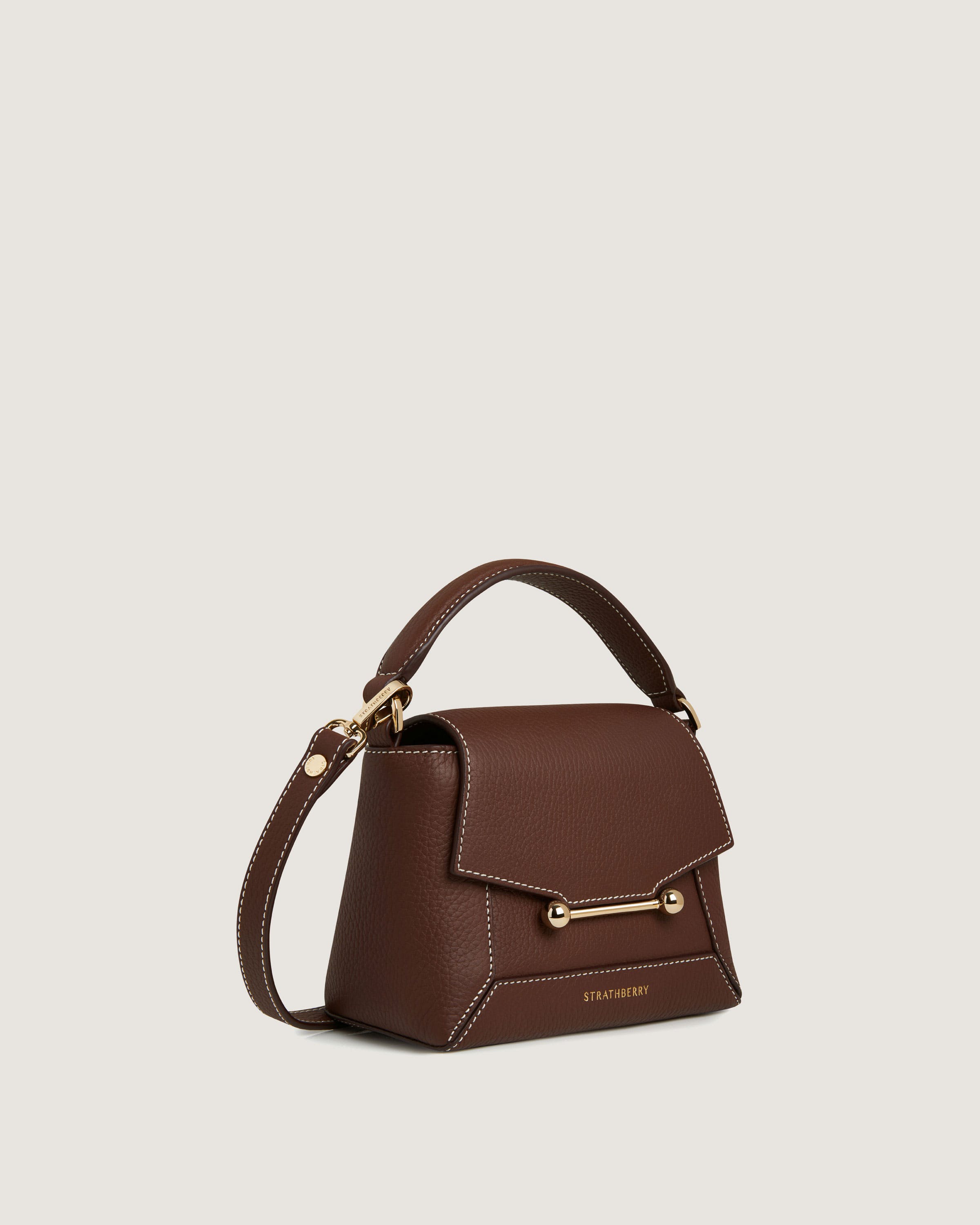 A brown handbag on a white background