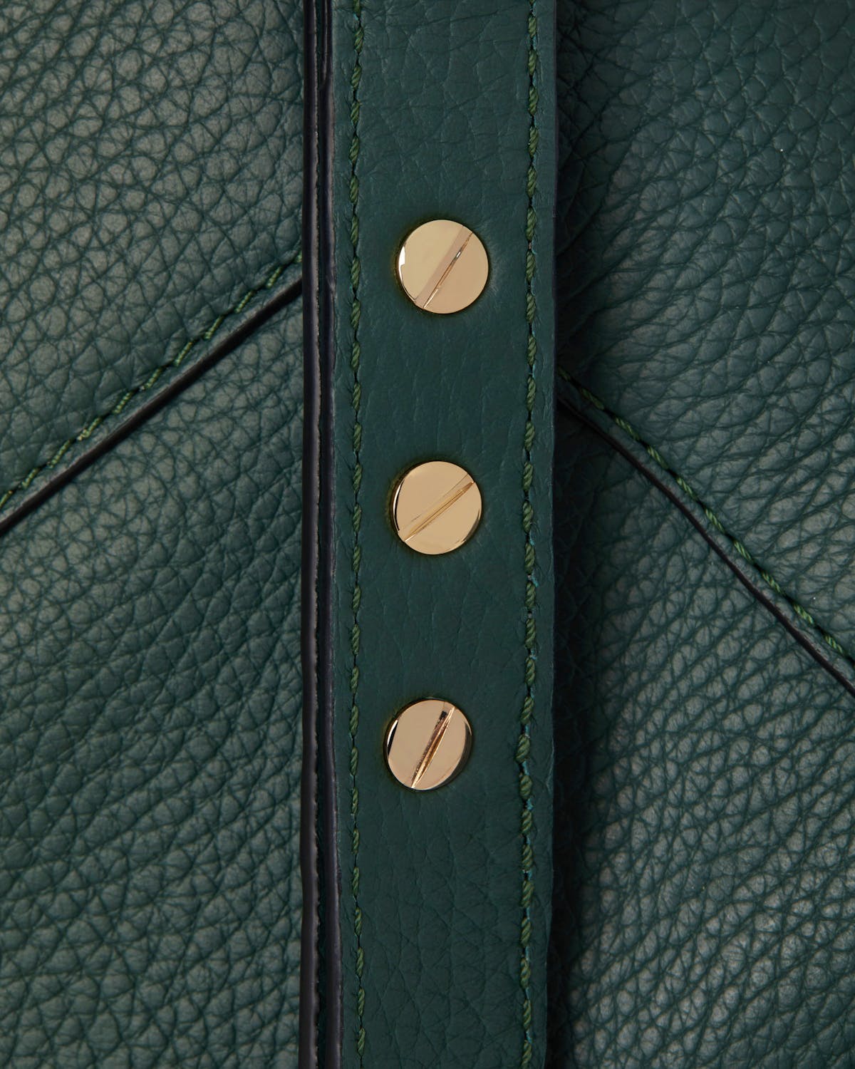 Bottle green mosaic bag strap in pebbled leather with three gold screw-head studs.
