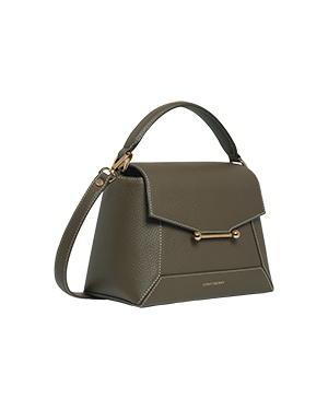 A grey handbag with a gold handle