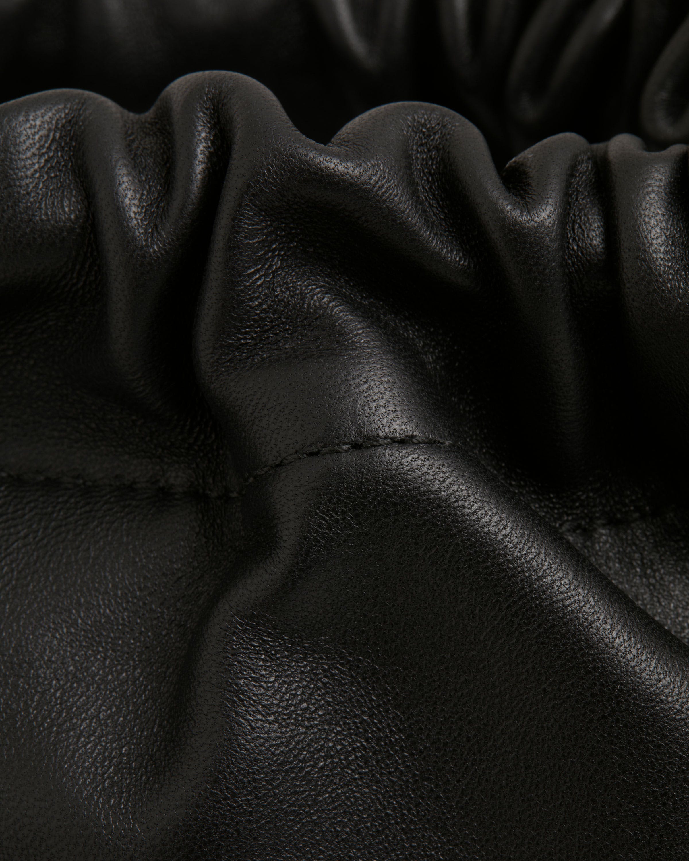 A close up of a black leather bag