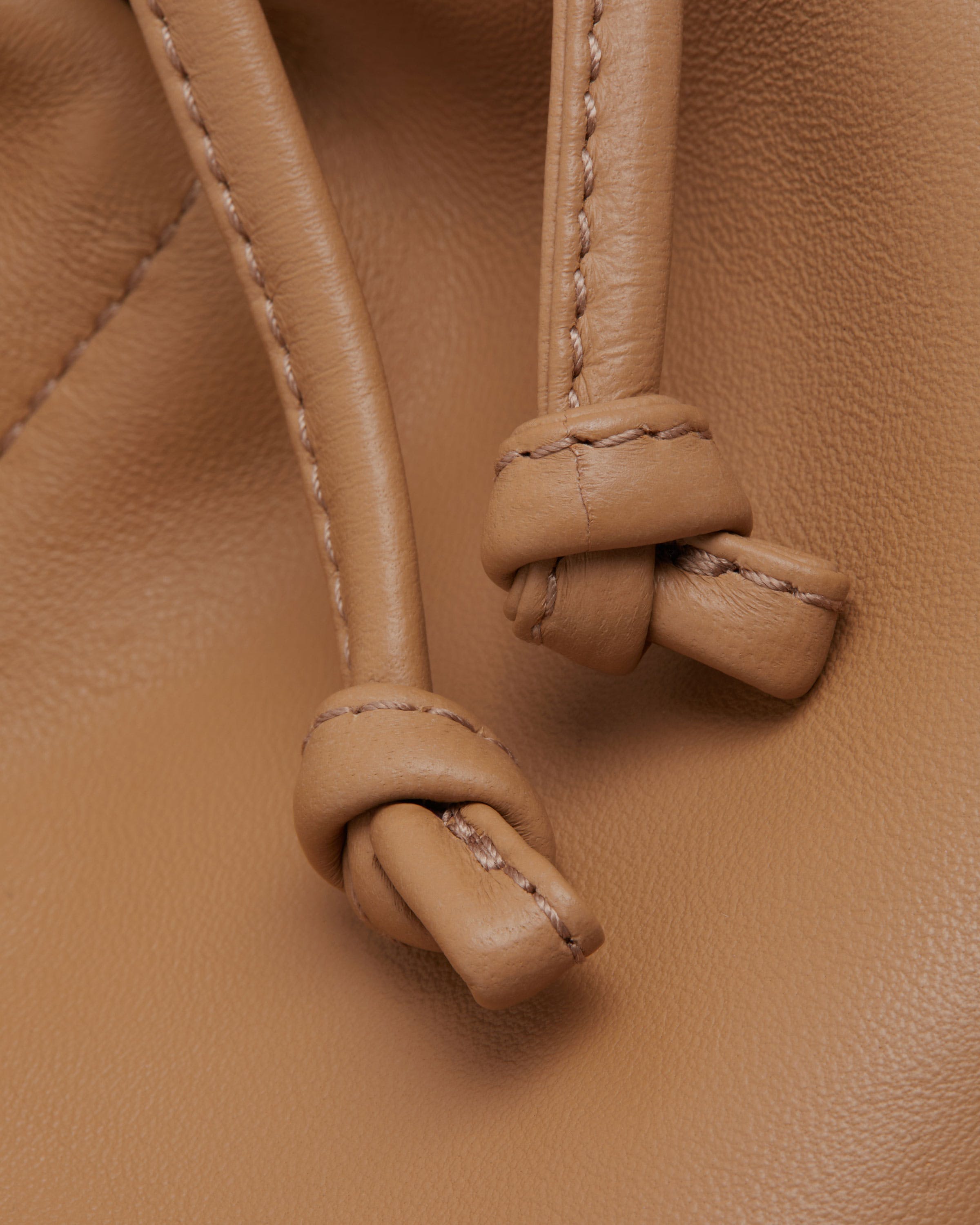 A close up of a brown leather bag