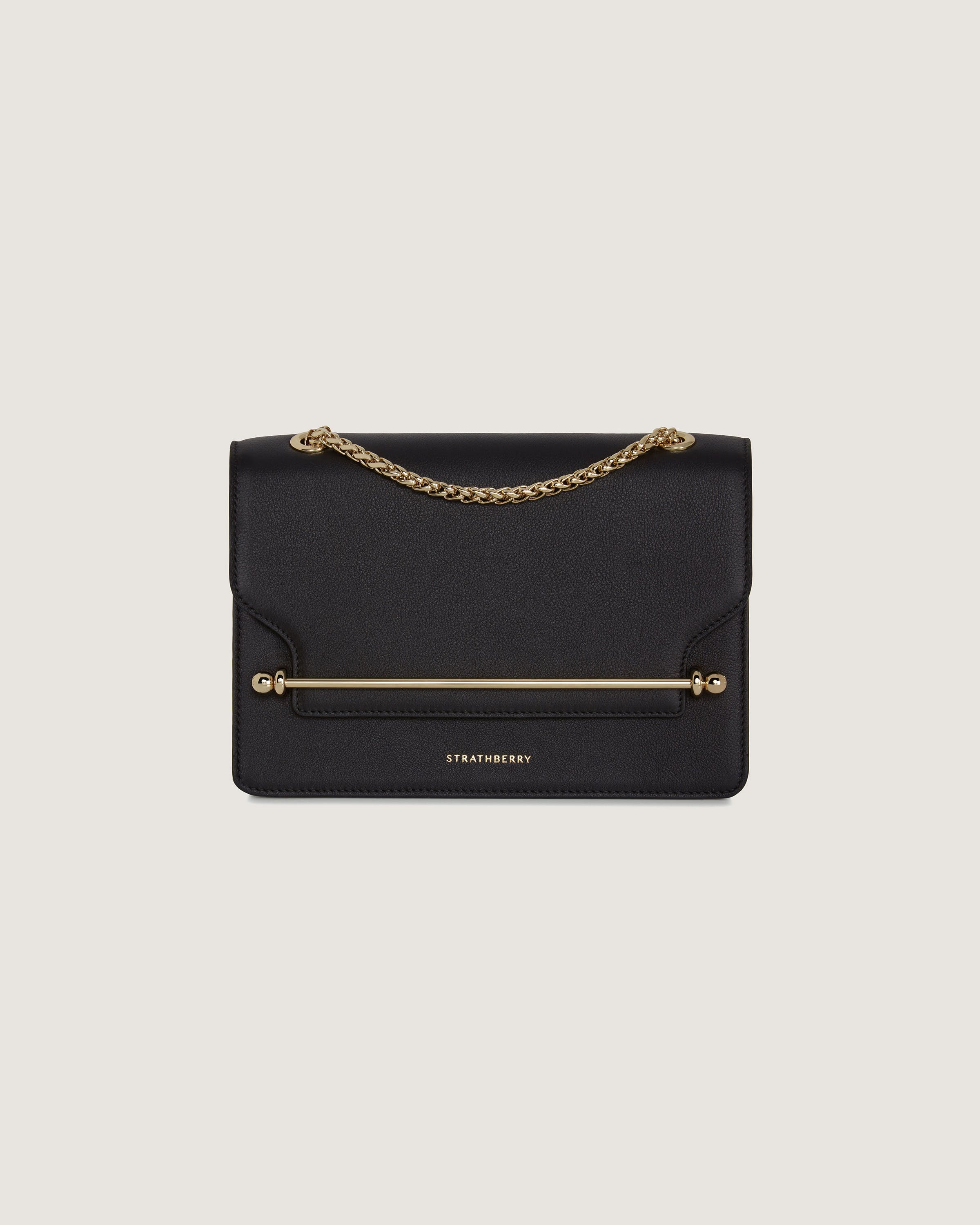 A black clutch bag with a gold chain