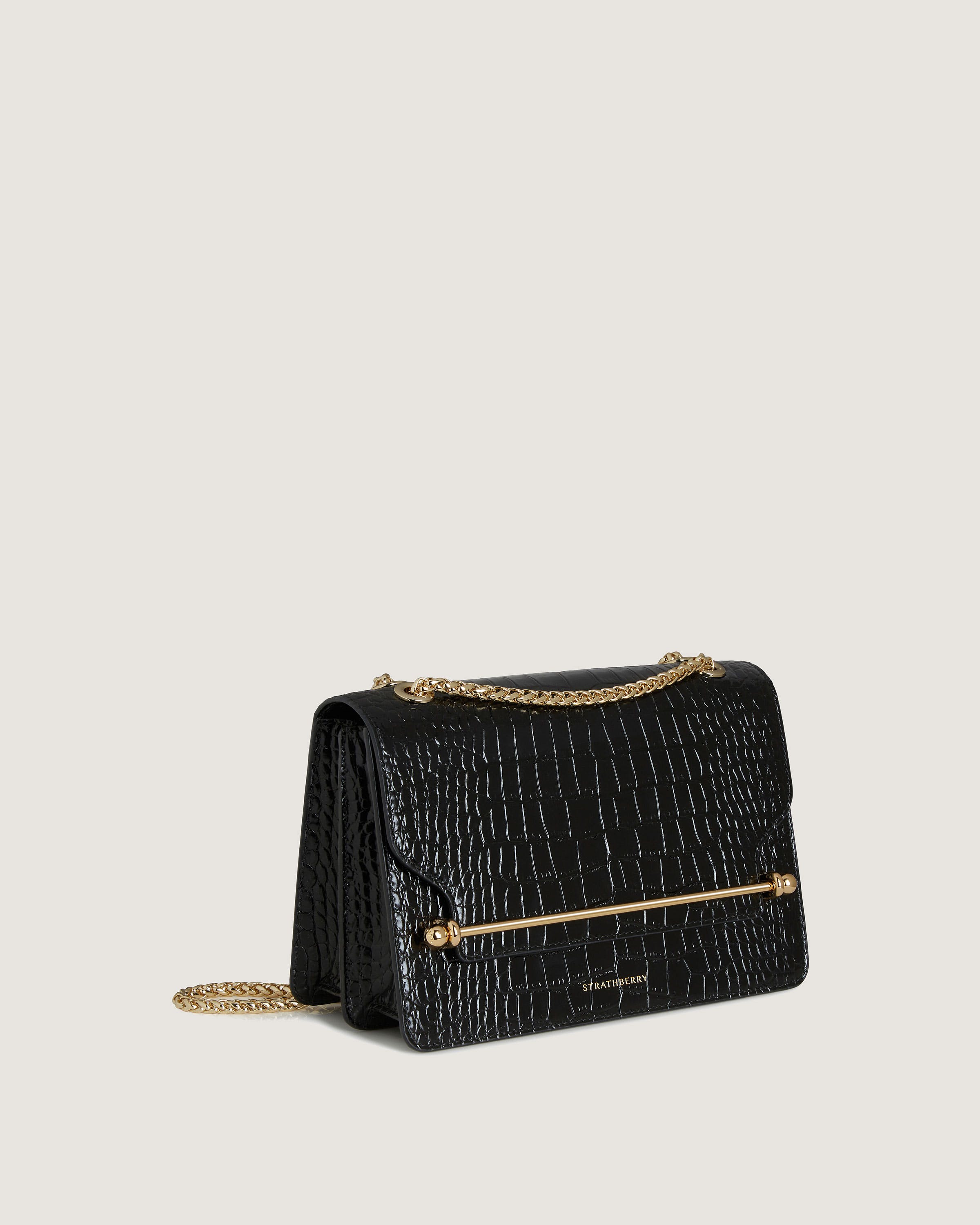 A black handbag on a white background