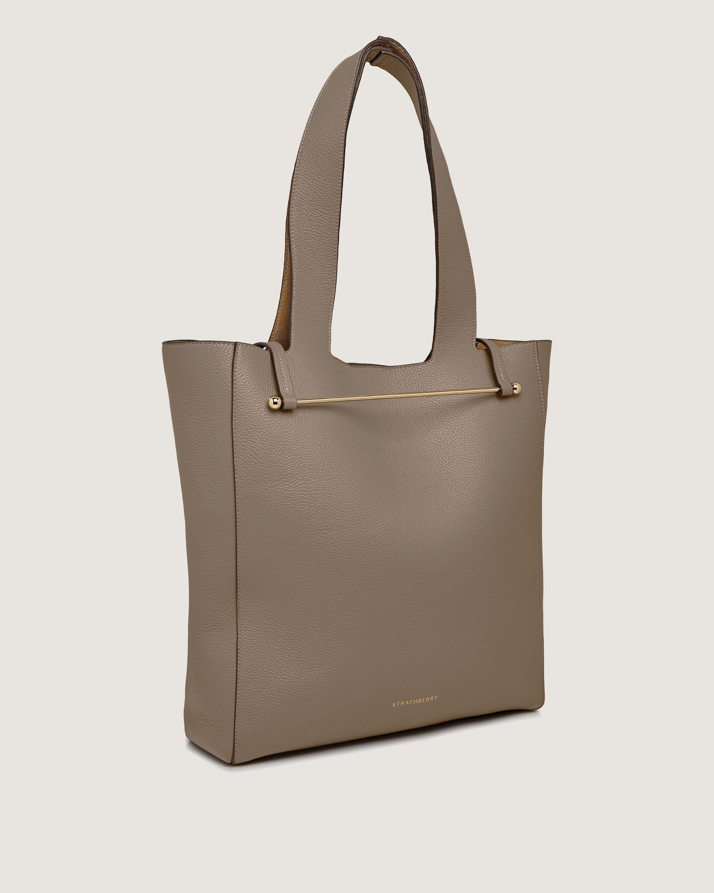 A beige tote bag on a white background