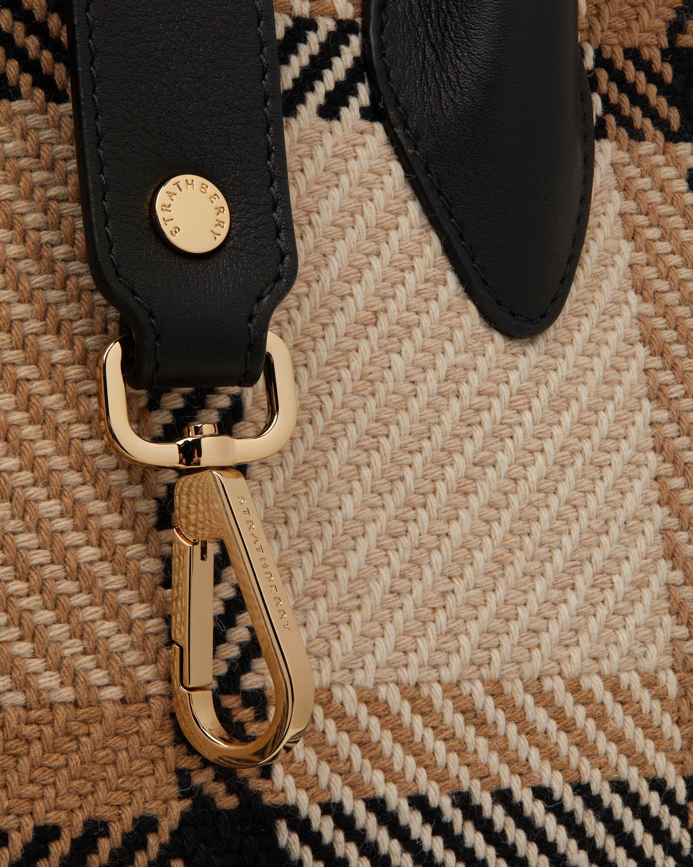 A close up of a pair of scissors on a rug