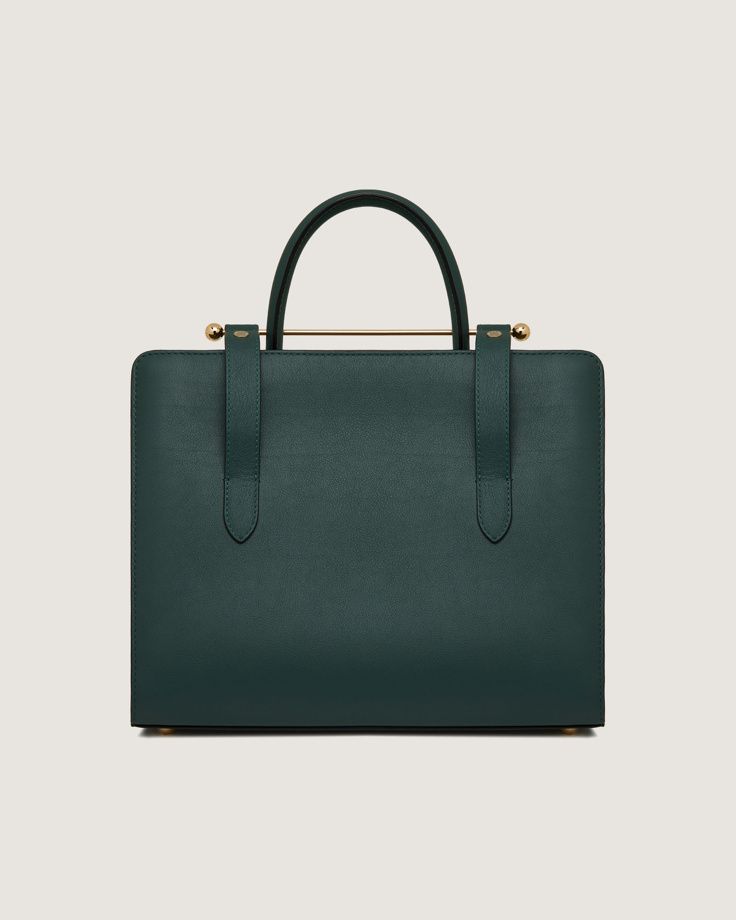 A green leather briefcase with a gold handle