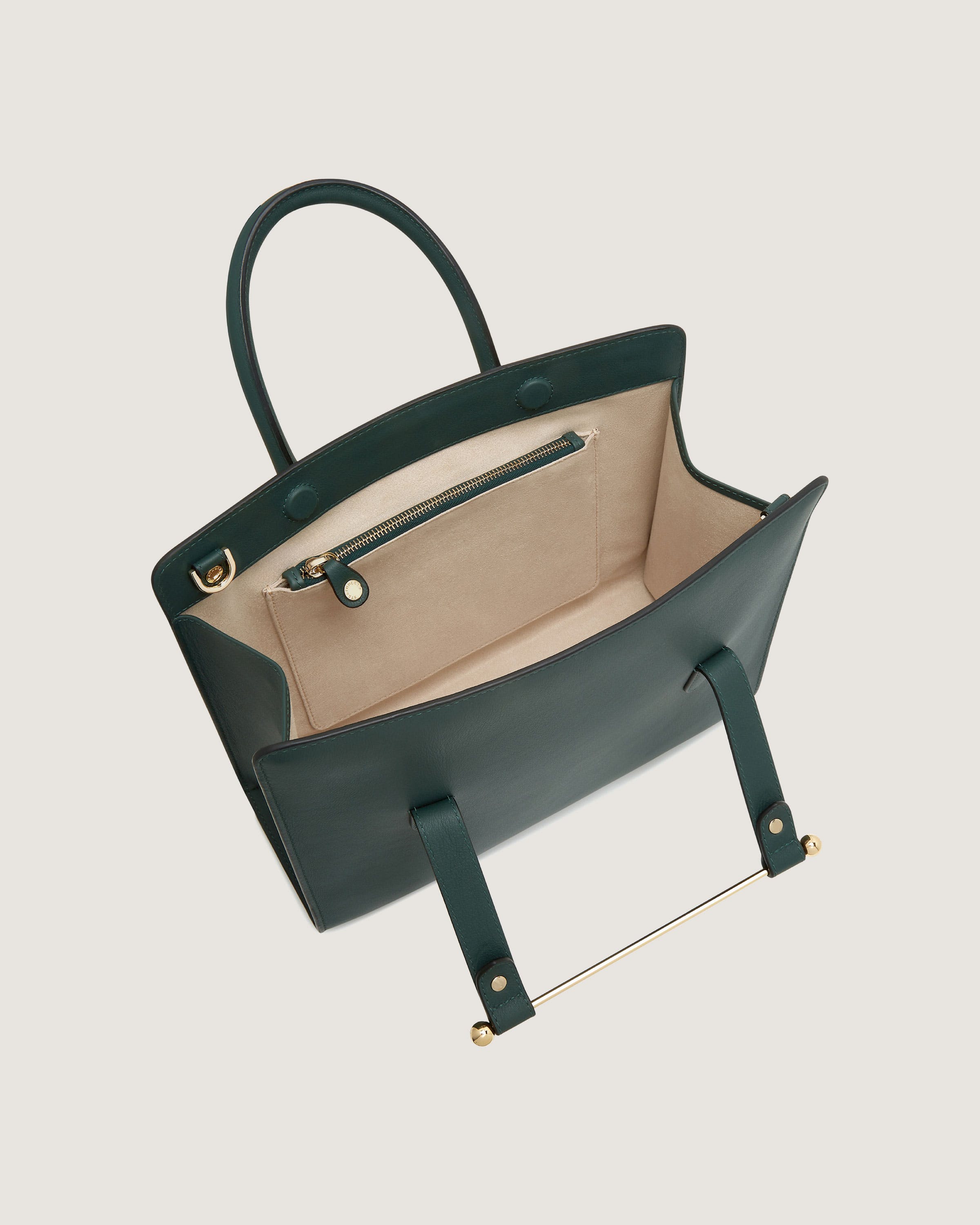 A black and beige handbag with a handle