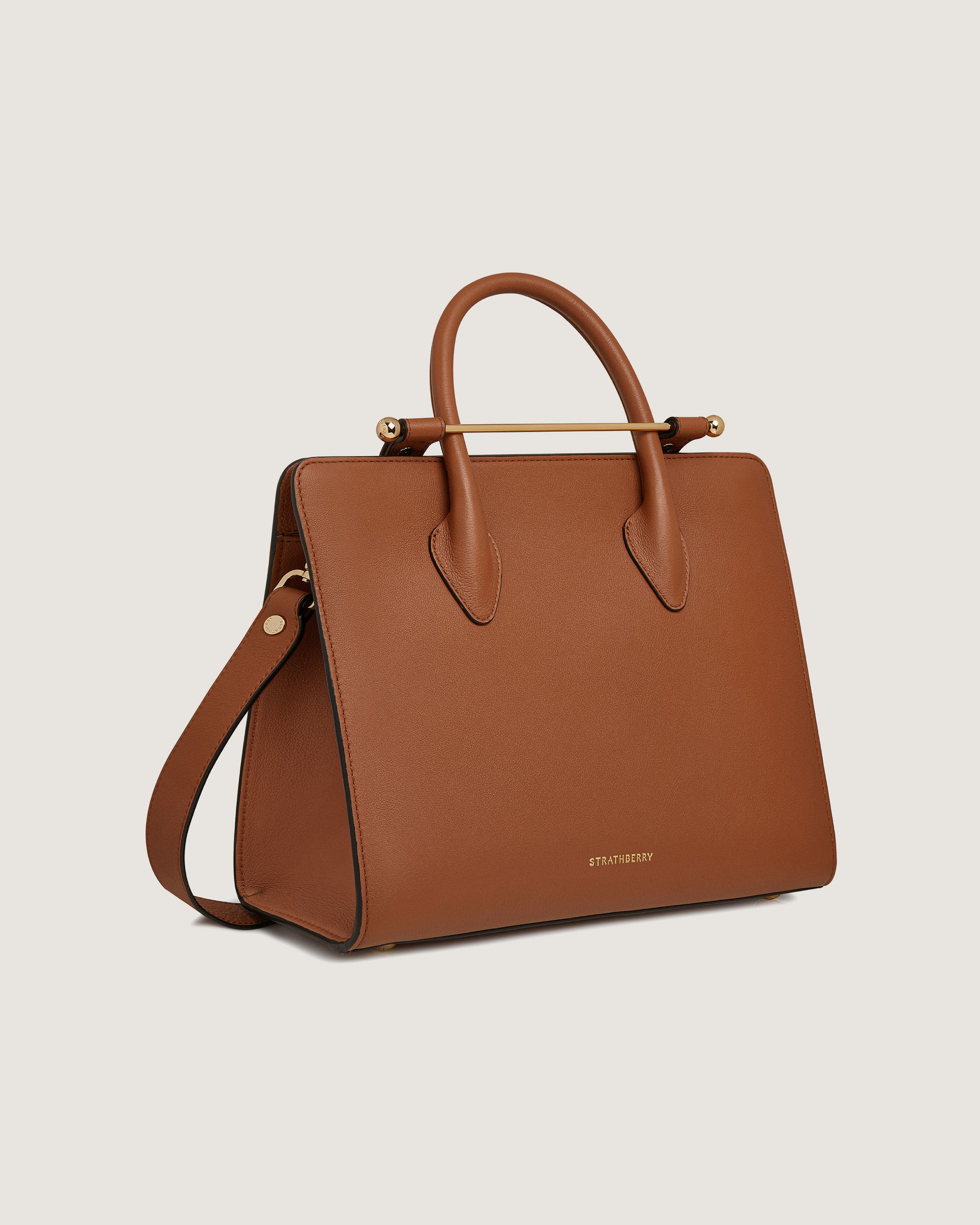 A brown handbag on a white background