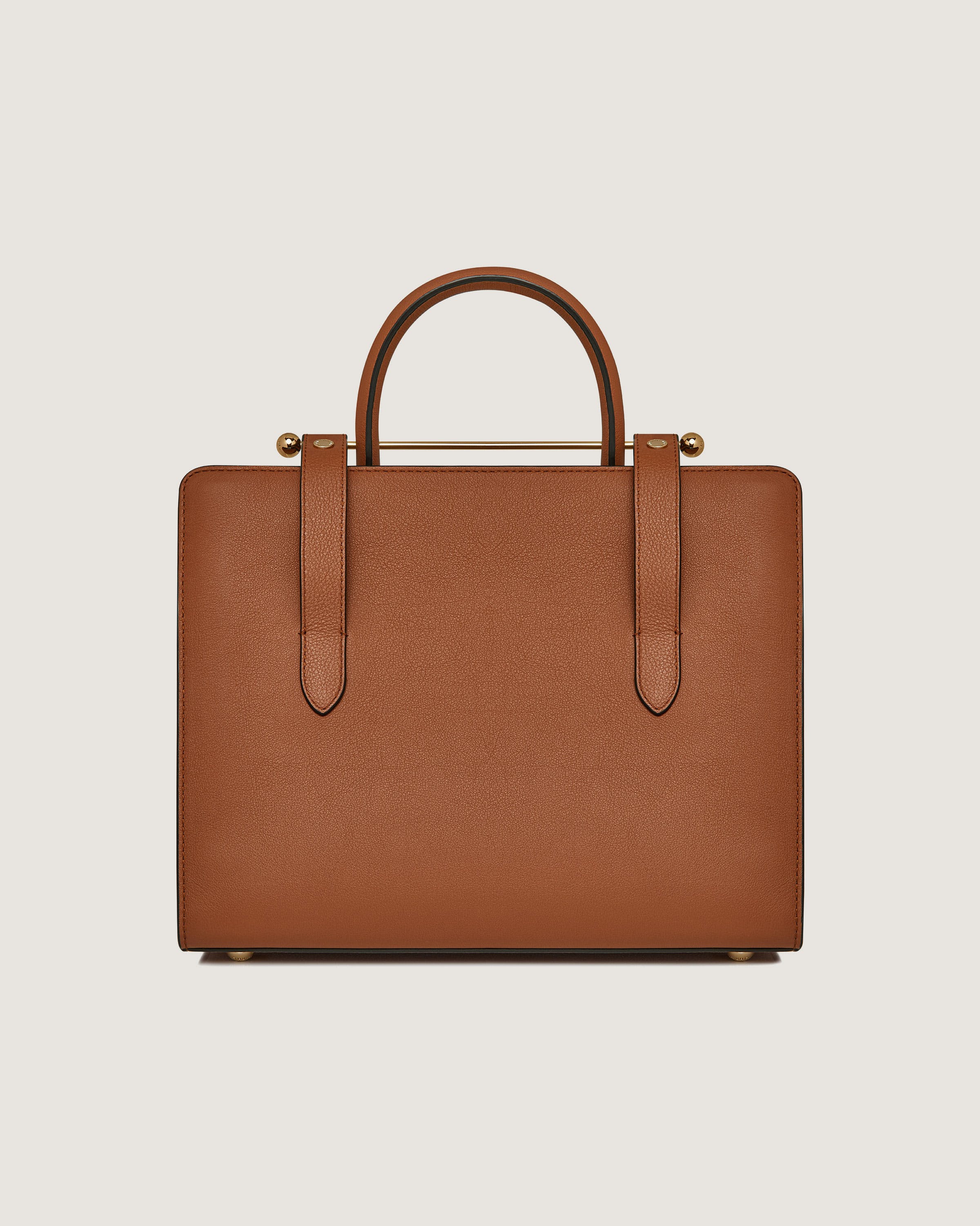 A tan briefcase with a handle on a white background