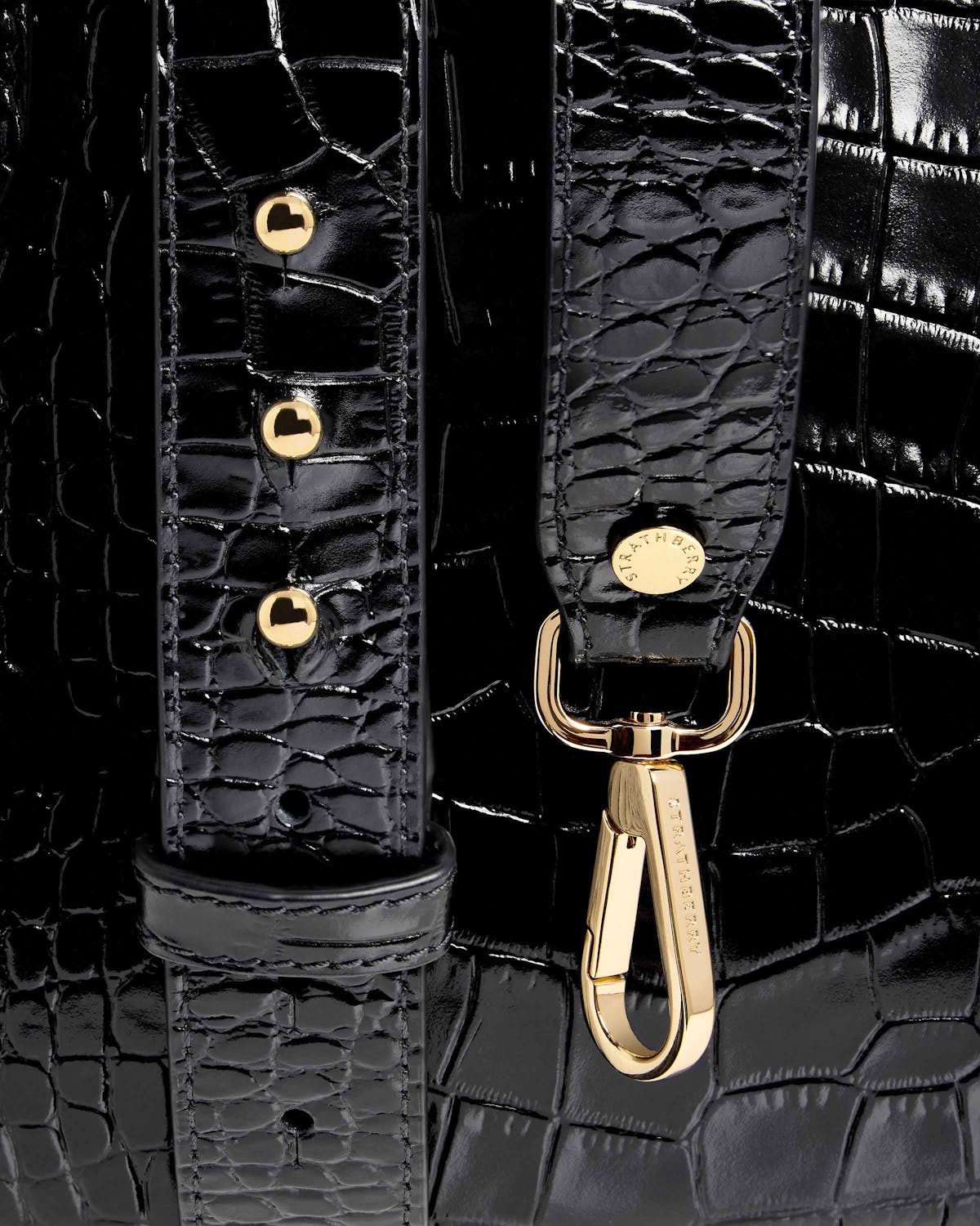 Black croc leather midi tote strap with gold Strathberry clasp and studs.
