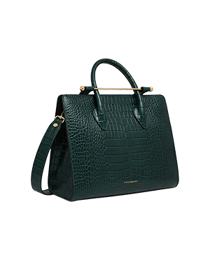 A green handbag with a gold handle