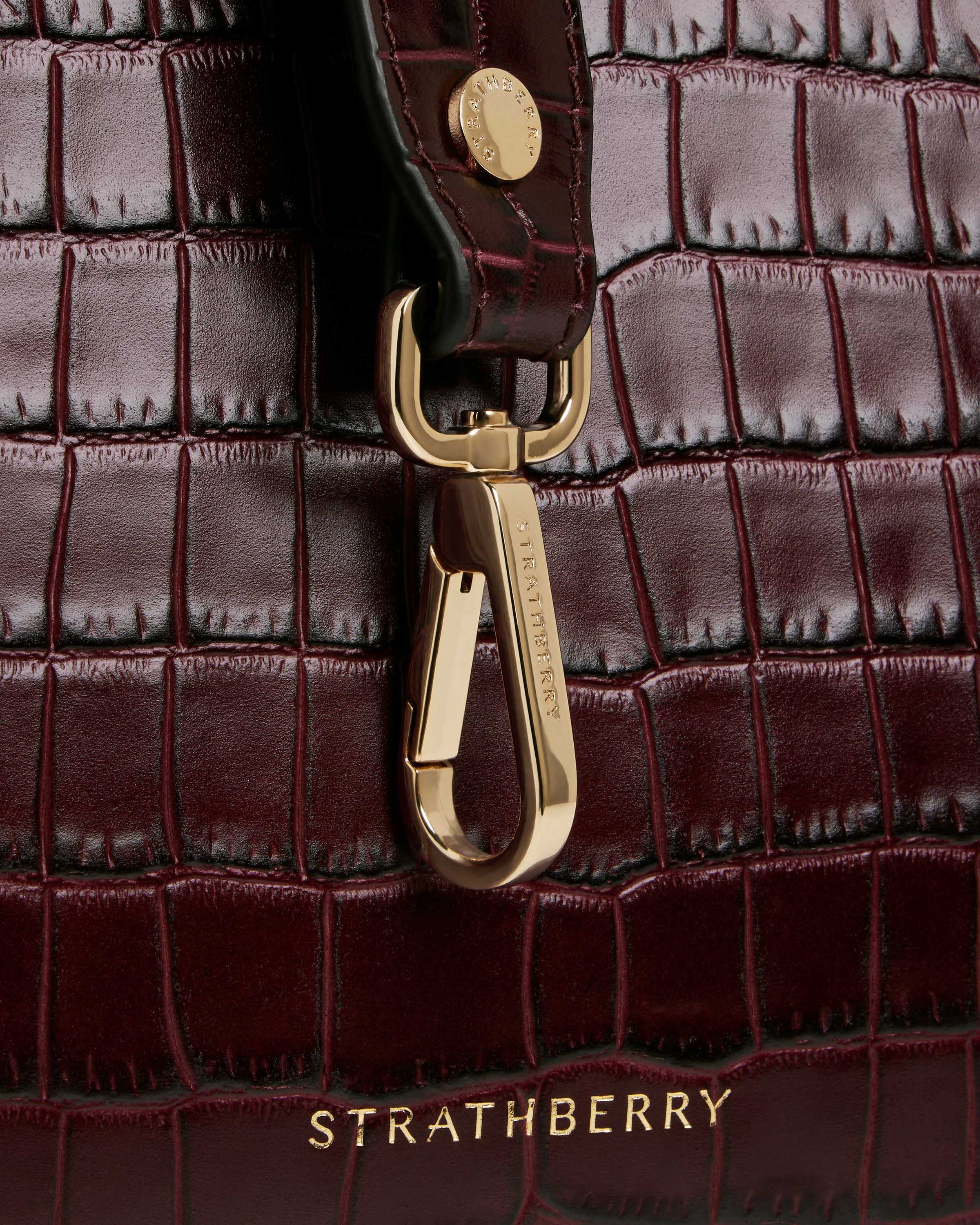 A close up of a handbag on a white background