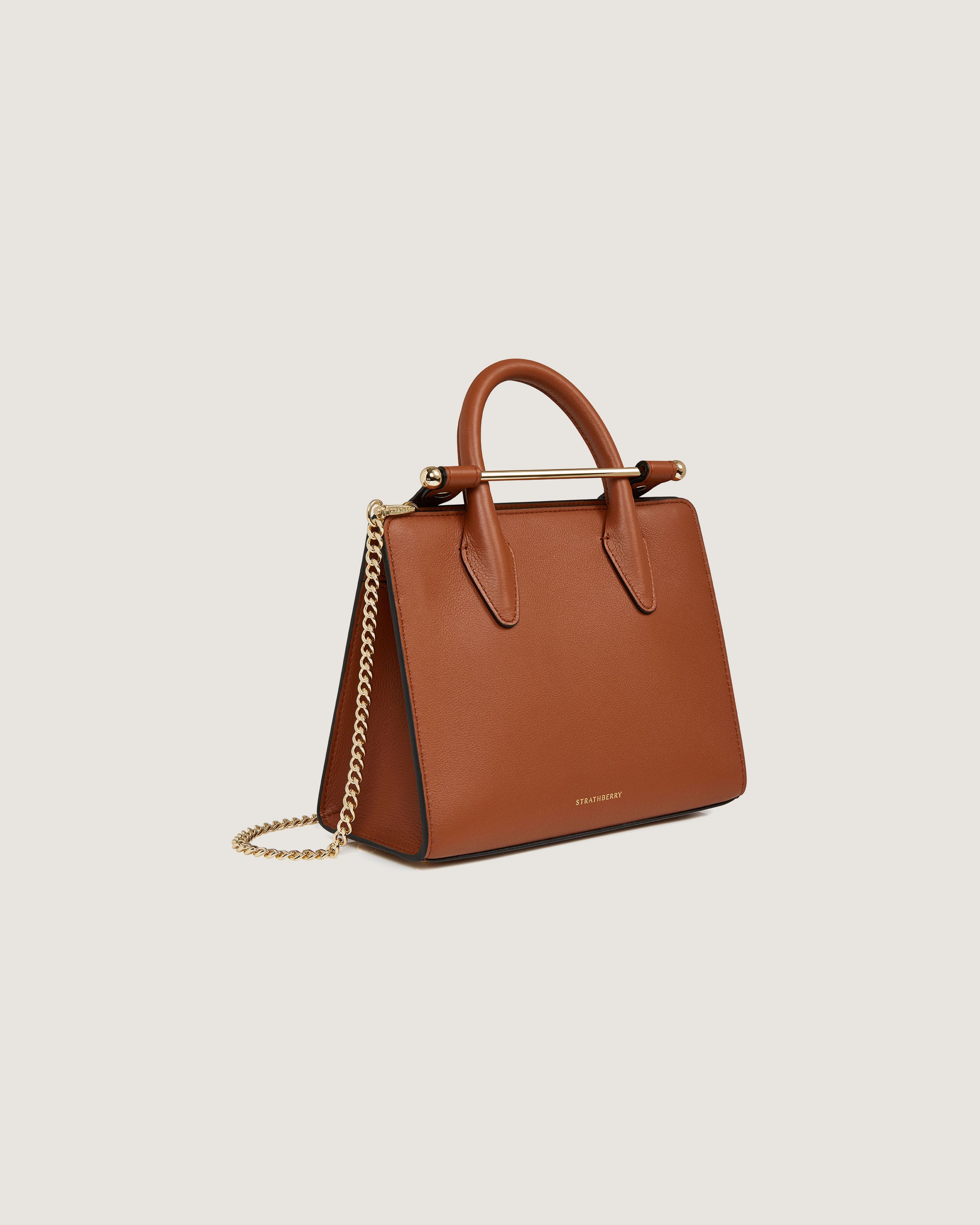 A brown handbag with a gold chain