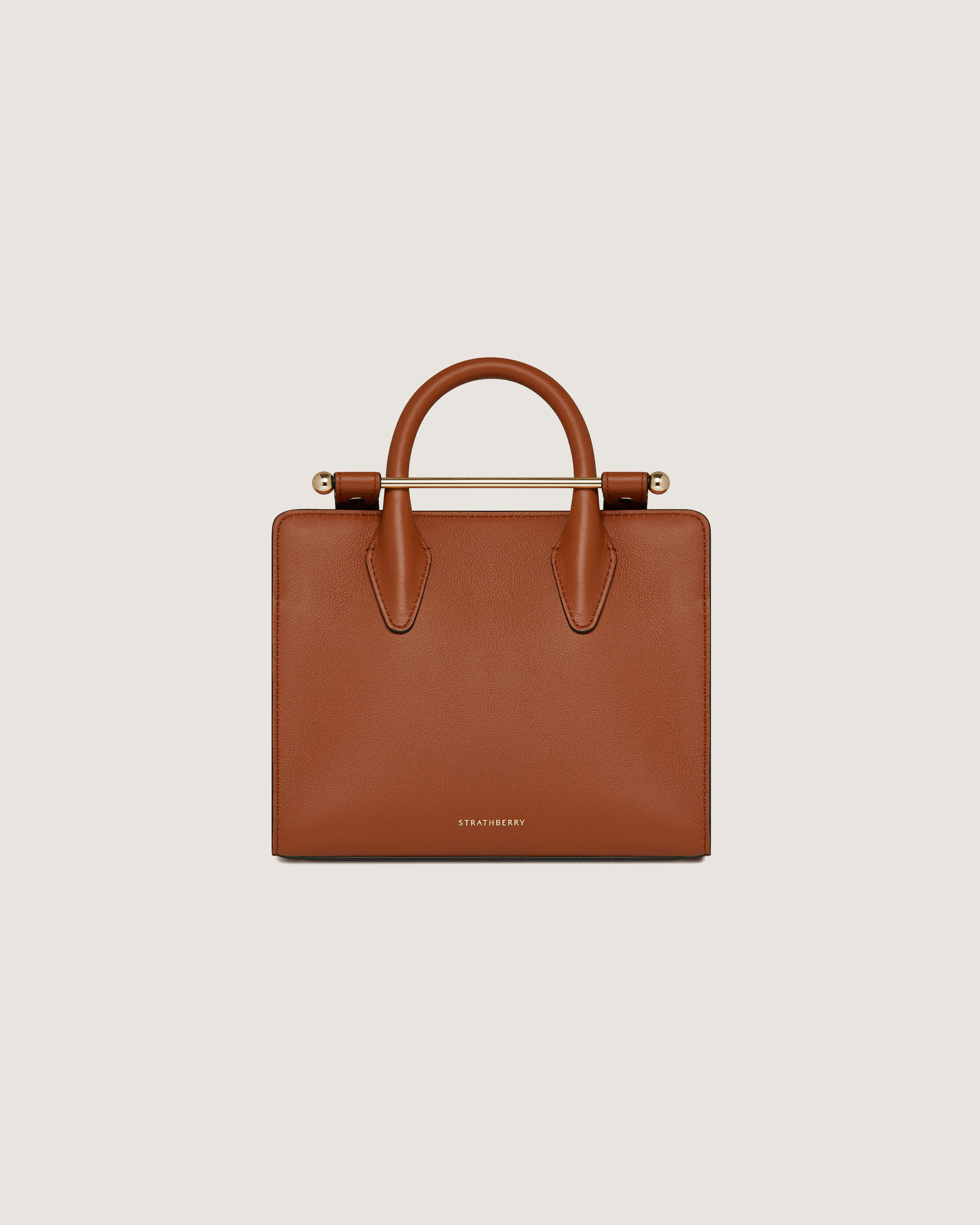 A brown handbag on a white background