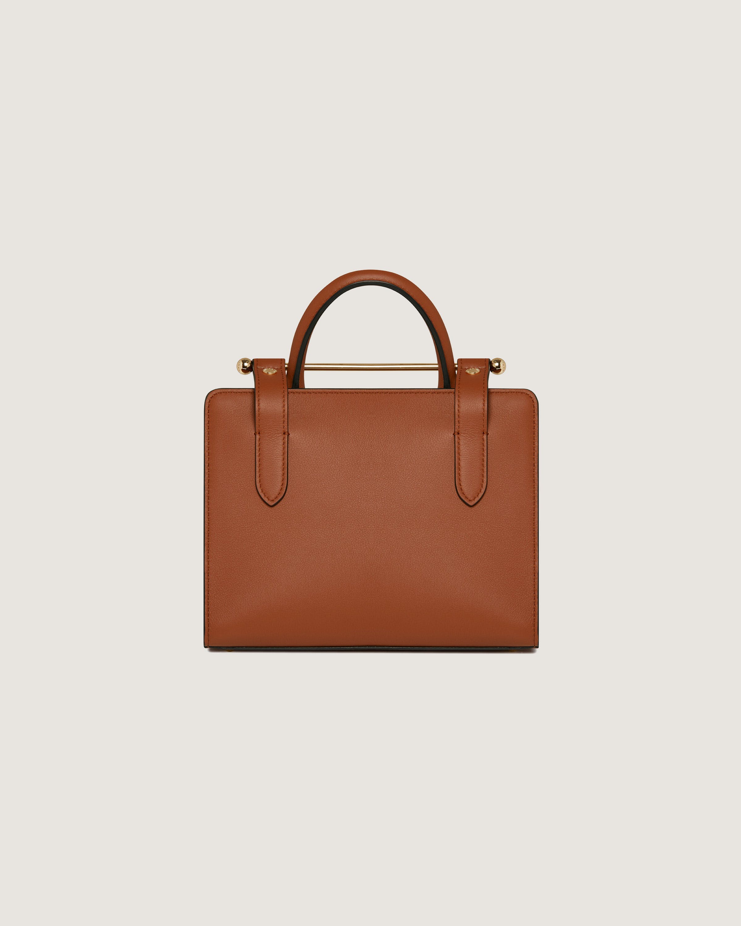 A brown handbag on a white background