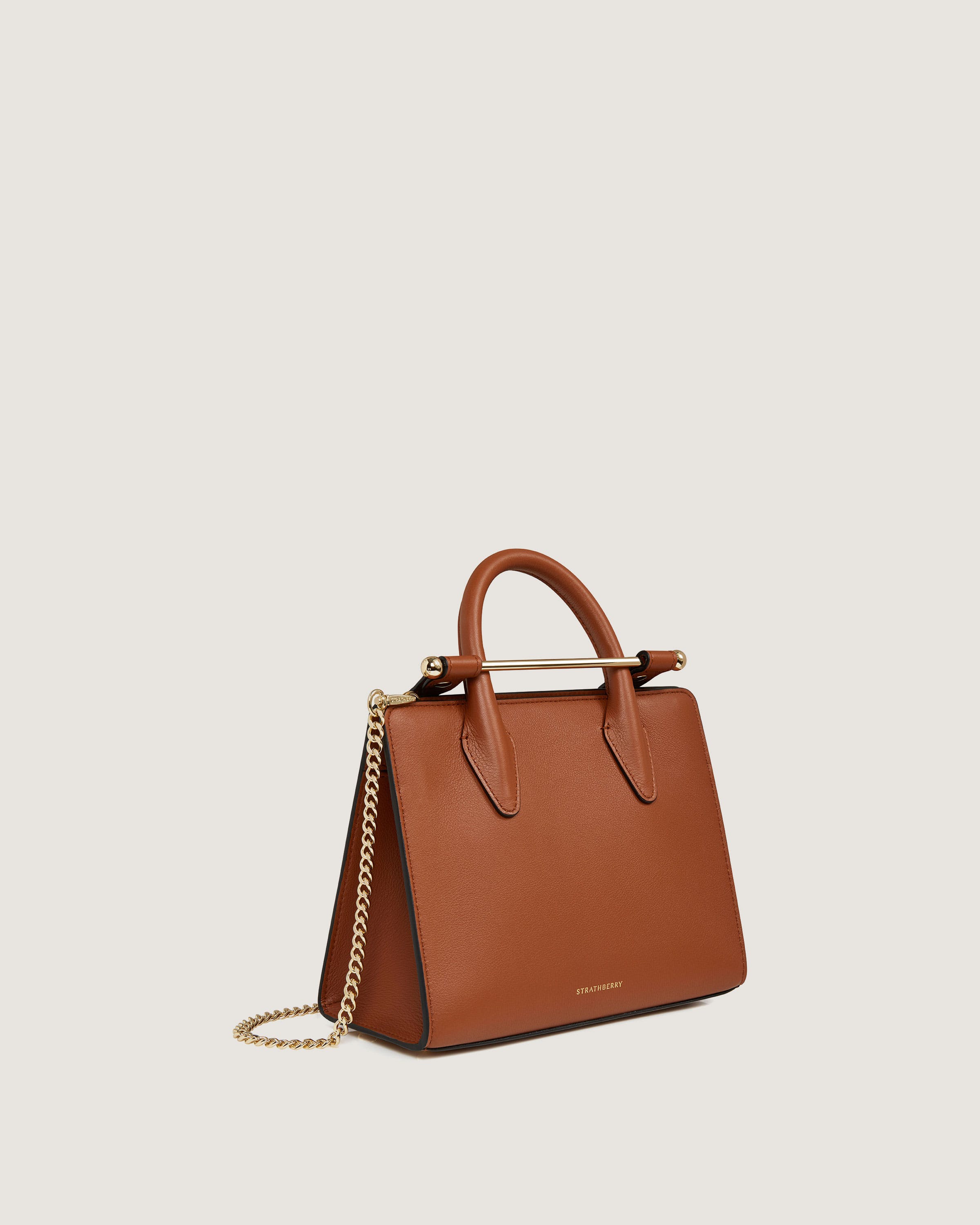 A brown handbag with a gold chain