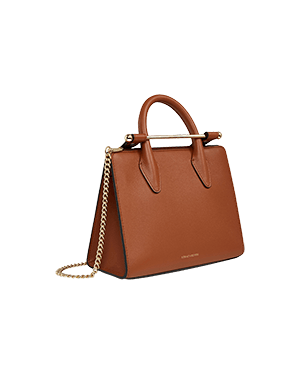 A brown handbag on a green background