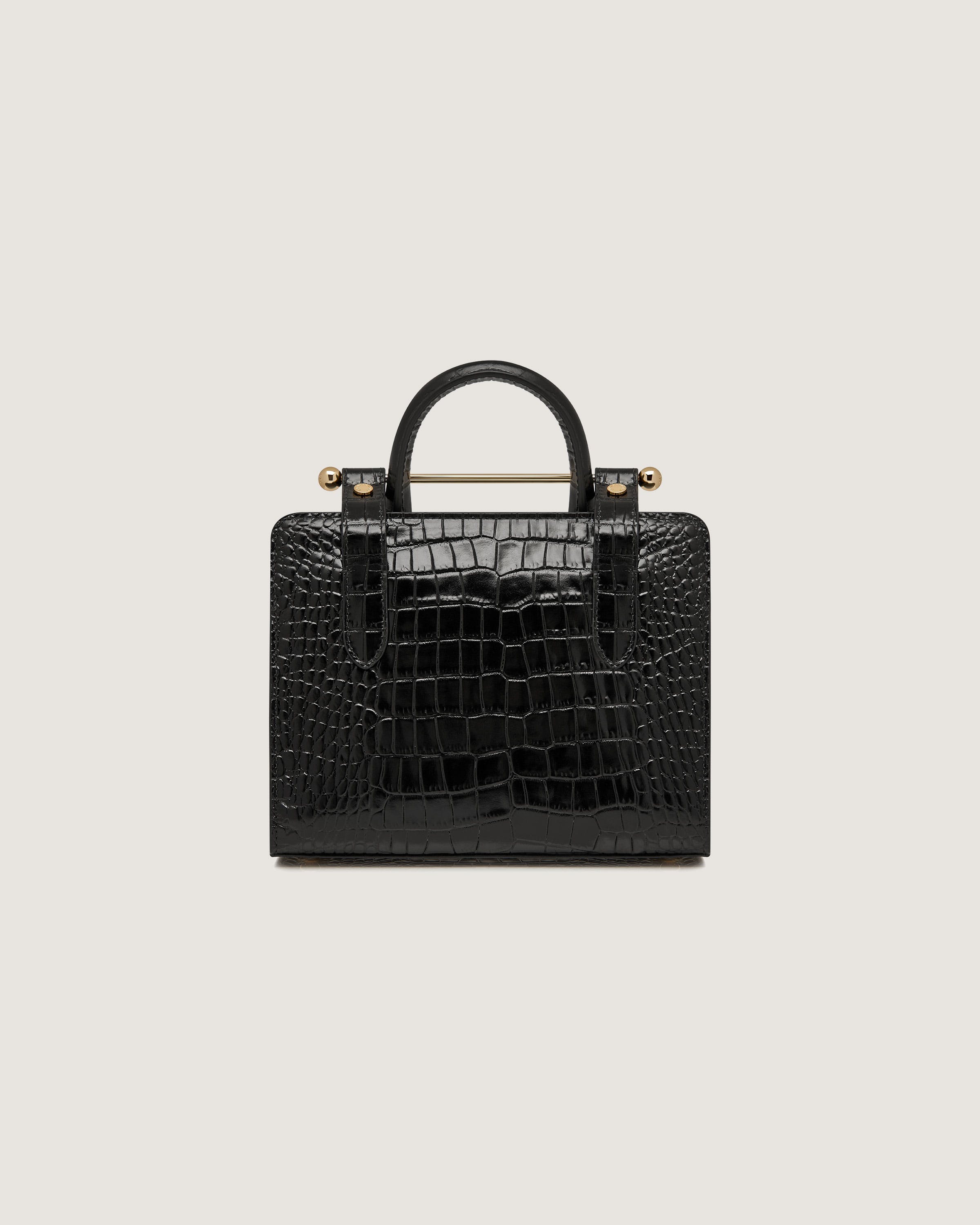 A black crocodile - embossed leather handbag