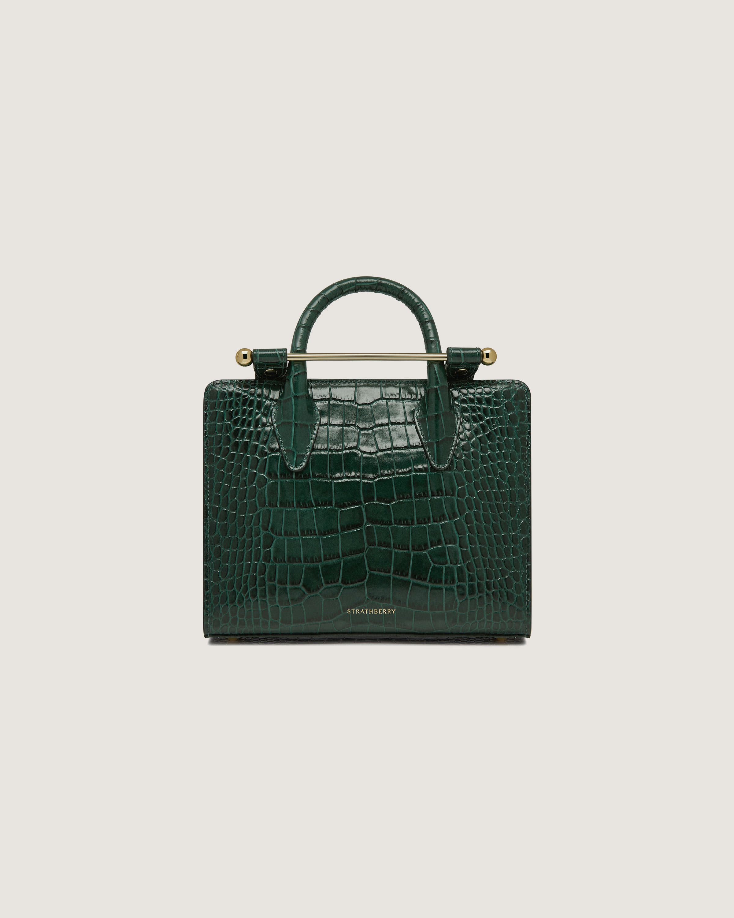 A green crocodile - embossed leather bag