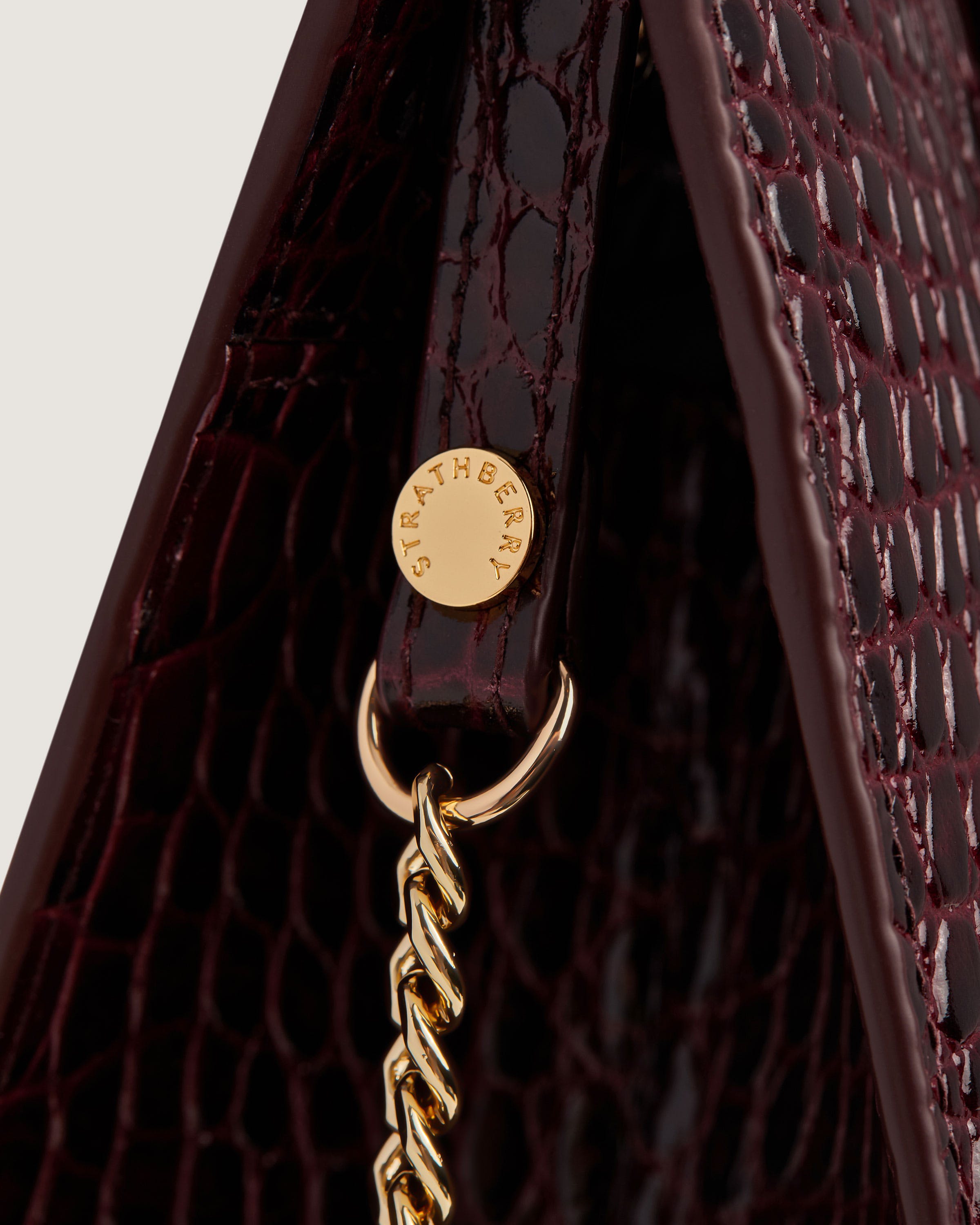 A close up of a handbag with a chain