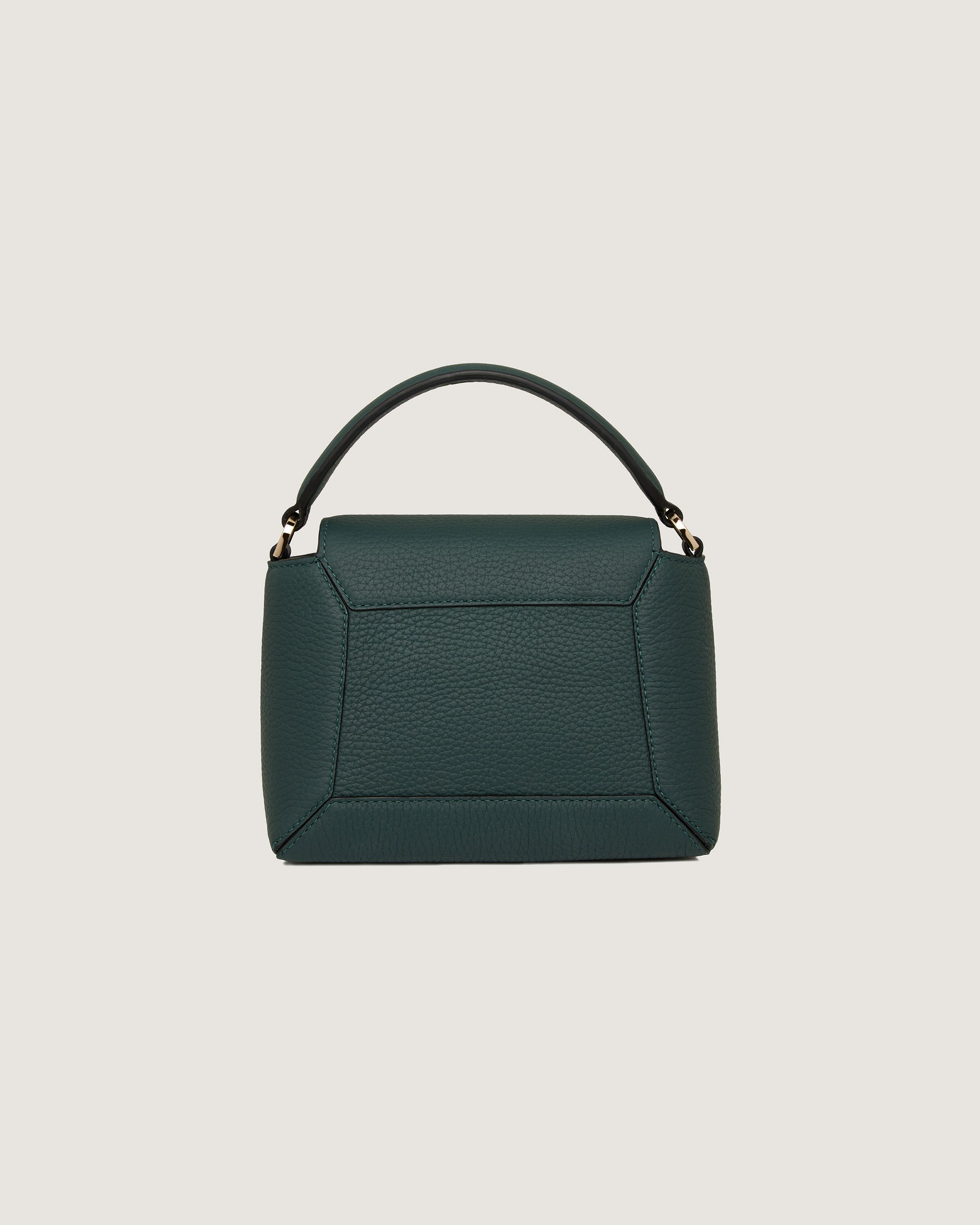 A green handbag with a handle on a white background