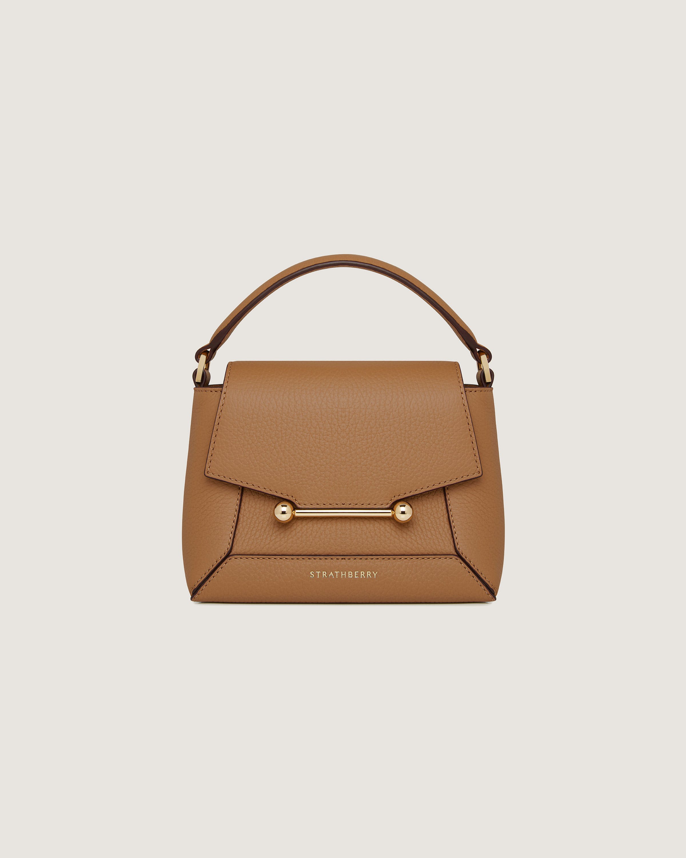 A brown handbag with a handle on a white background